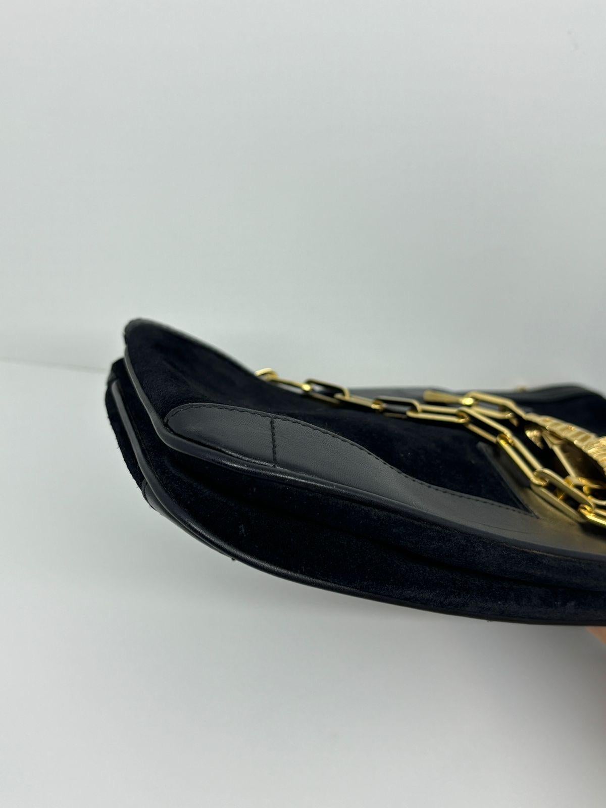 Vintage Gucci Tiger head lock suede bag in black. Beautiful vintage design, perfect for formal wear. Slight marks throughout the suede and the corners. Comes as is. The chain is long enough to be worn as crossbody bag.