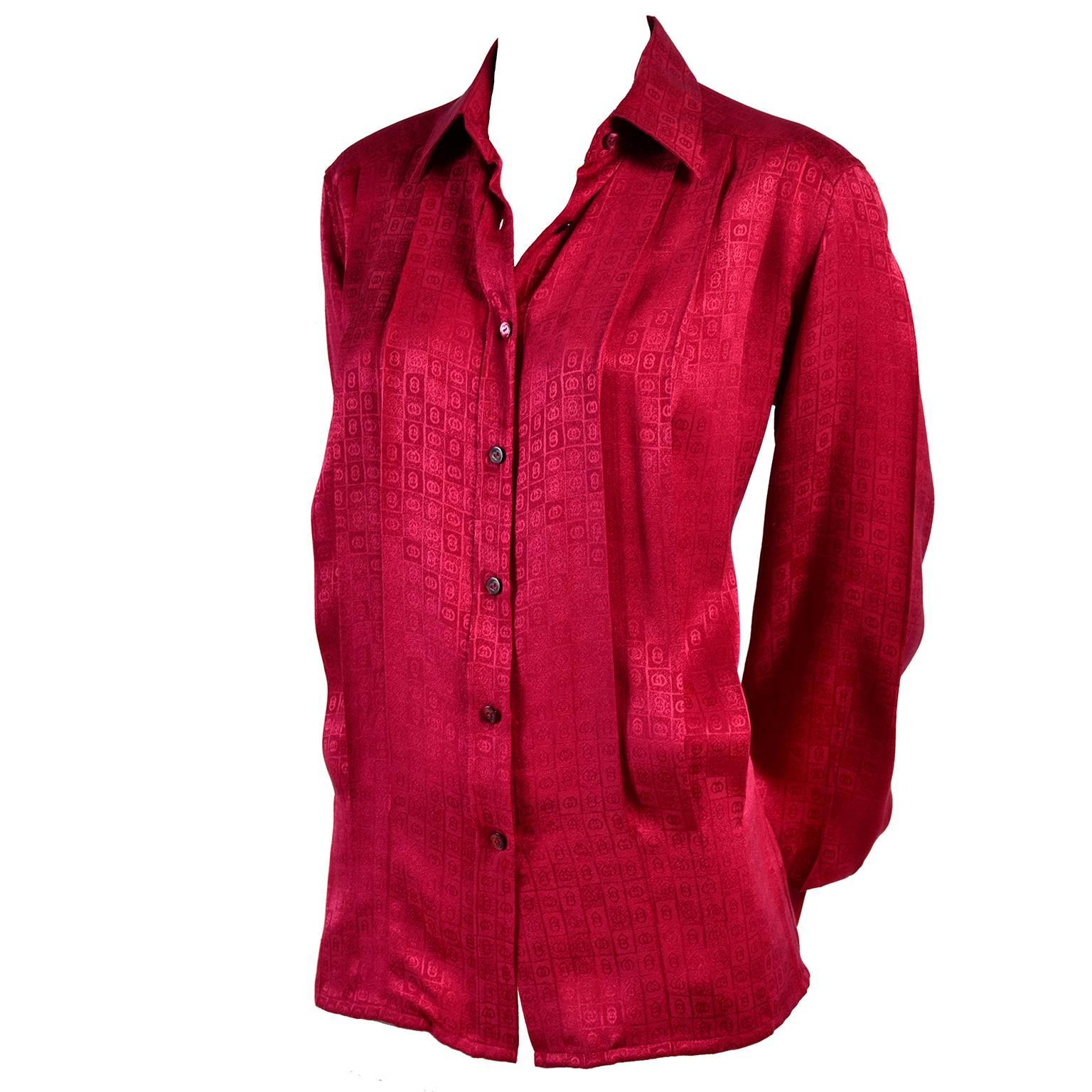 This is a gorgeous Gucci silk blouse in a deep red with the Gucci G logo signature in the tone on tone print.  This early 1980's blouse also has Gucci written on the buttons up the front. These Gucci silk blouses are so well made and they are always