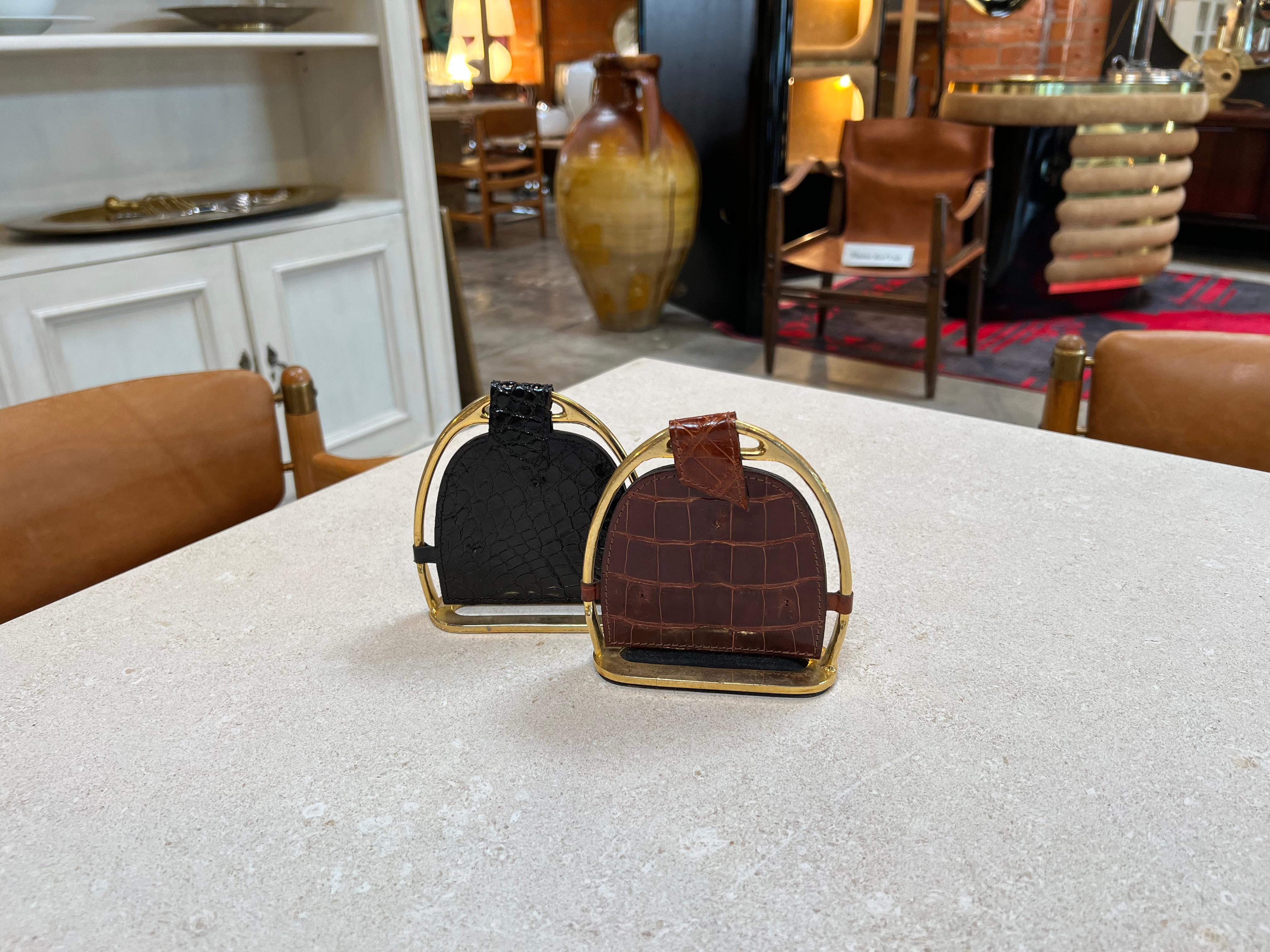 The Vintage Gucci Book Ends from the 1980s are stylish and luxurious accessories designed to hold books in place while adding a touch of sophistication to any space. Made by the renowned fashion house Gucci, these bookends feature the iconic Gucci