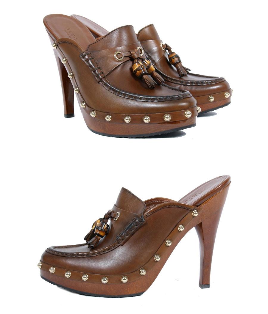 • Color: Brown
• Antiqued smooth leather upper
• Shaded moc toe
• Bamboo beaded tassel vamp
• Tonal topstitching
• 1¼''wood platform with gold tone studded leather trim
• 5.5'' lacquered wood heel
• Rubber sole
Made in Italy

 Size is 6 1/2