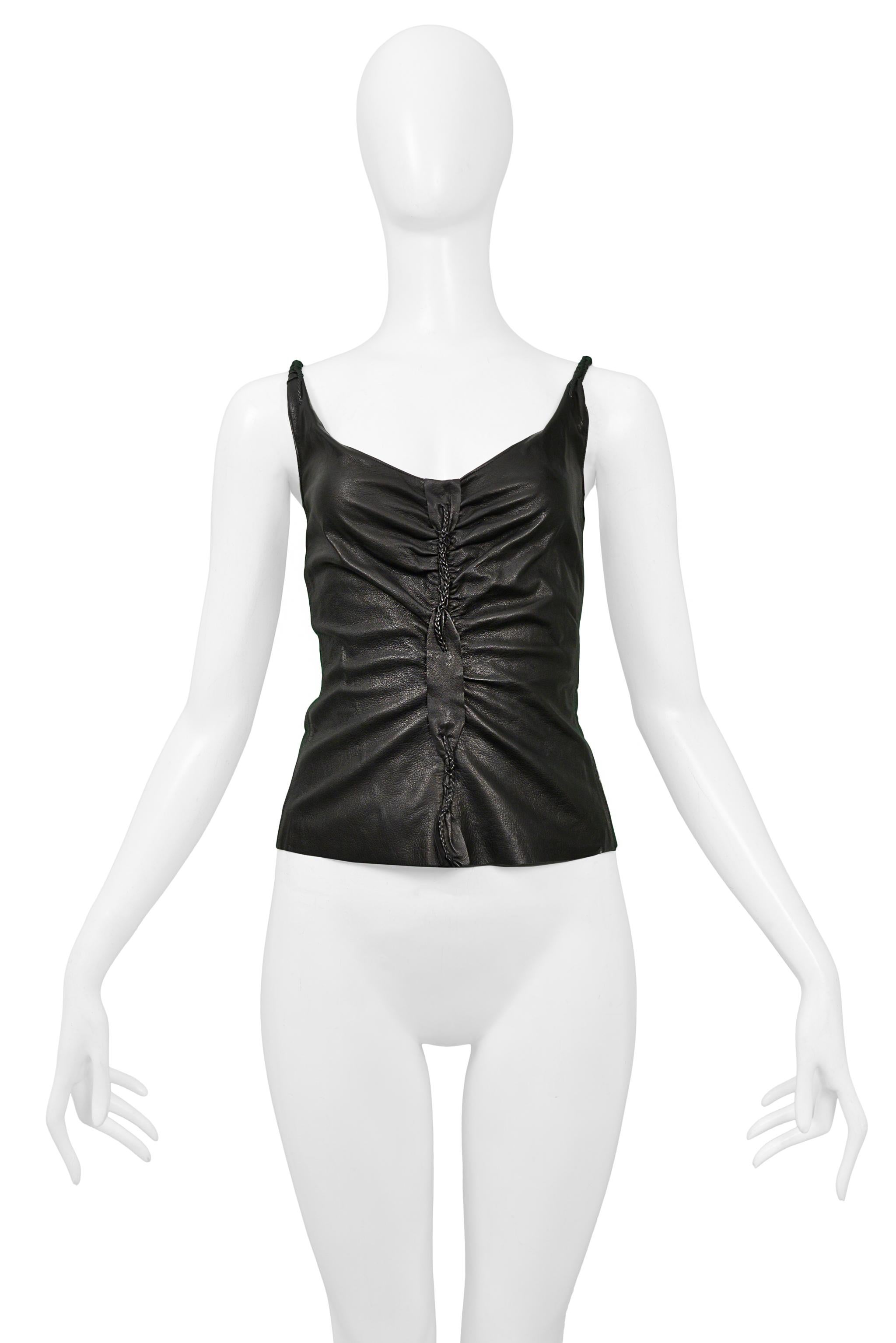 Resurrection Vintage is excited to offer a vintage black leather Tom Ford for Gucci tank top featuring a gathered back and center seam, braided detailing, and left back zipper closure.

Gucci
Designed by Tom Ford
Excellent Vintage