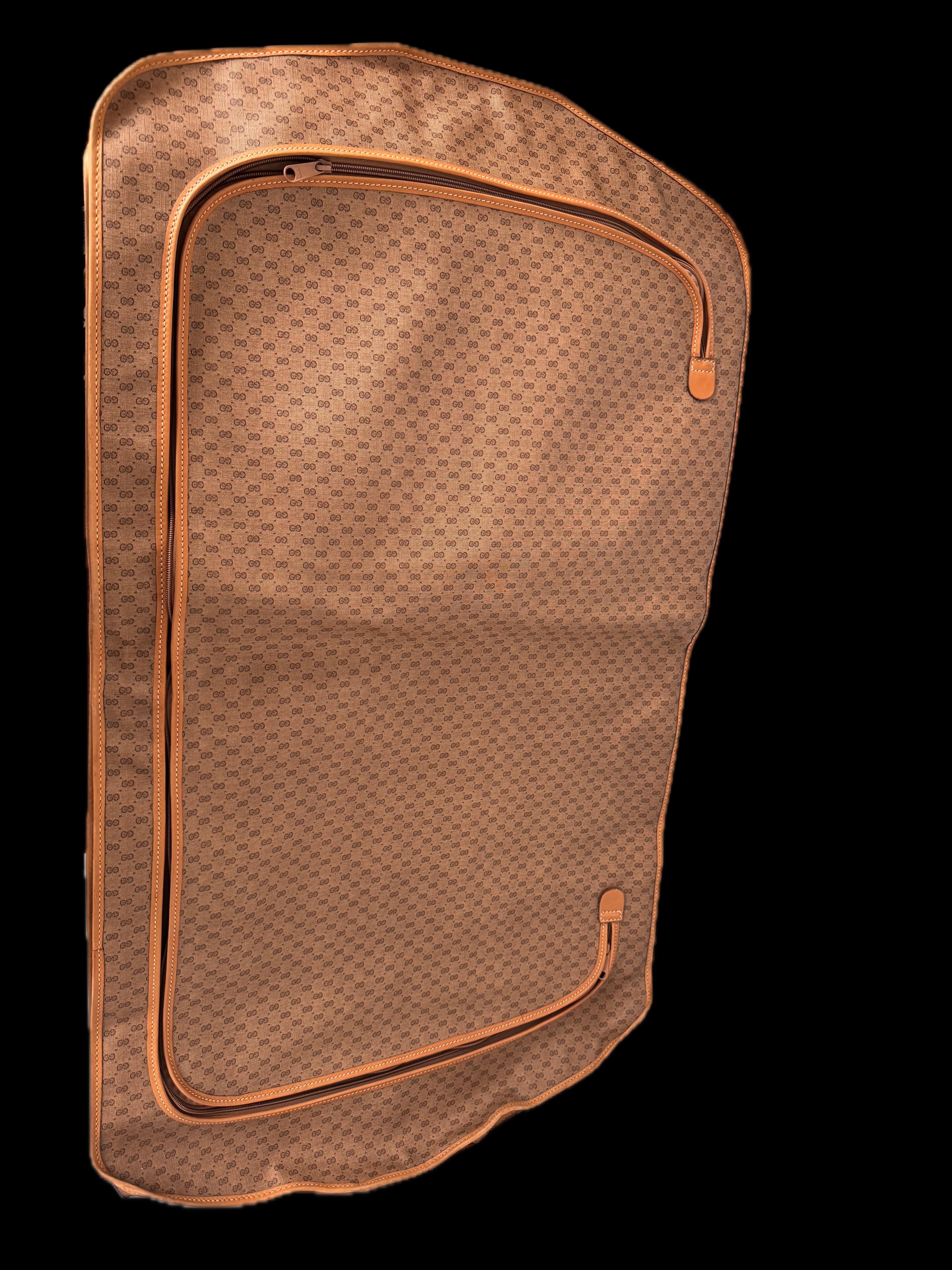Vintage Gucci Canvas GG Logo Garment Bag

Travel in timeless style with the vintage Gucci Canvas GG Logo Garment Bag, an essential accessory for the sophisticated traveler. Combining classic luxury with practical design, this bag ensures your