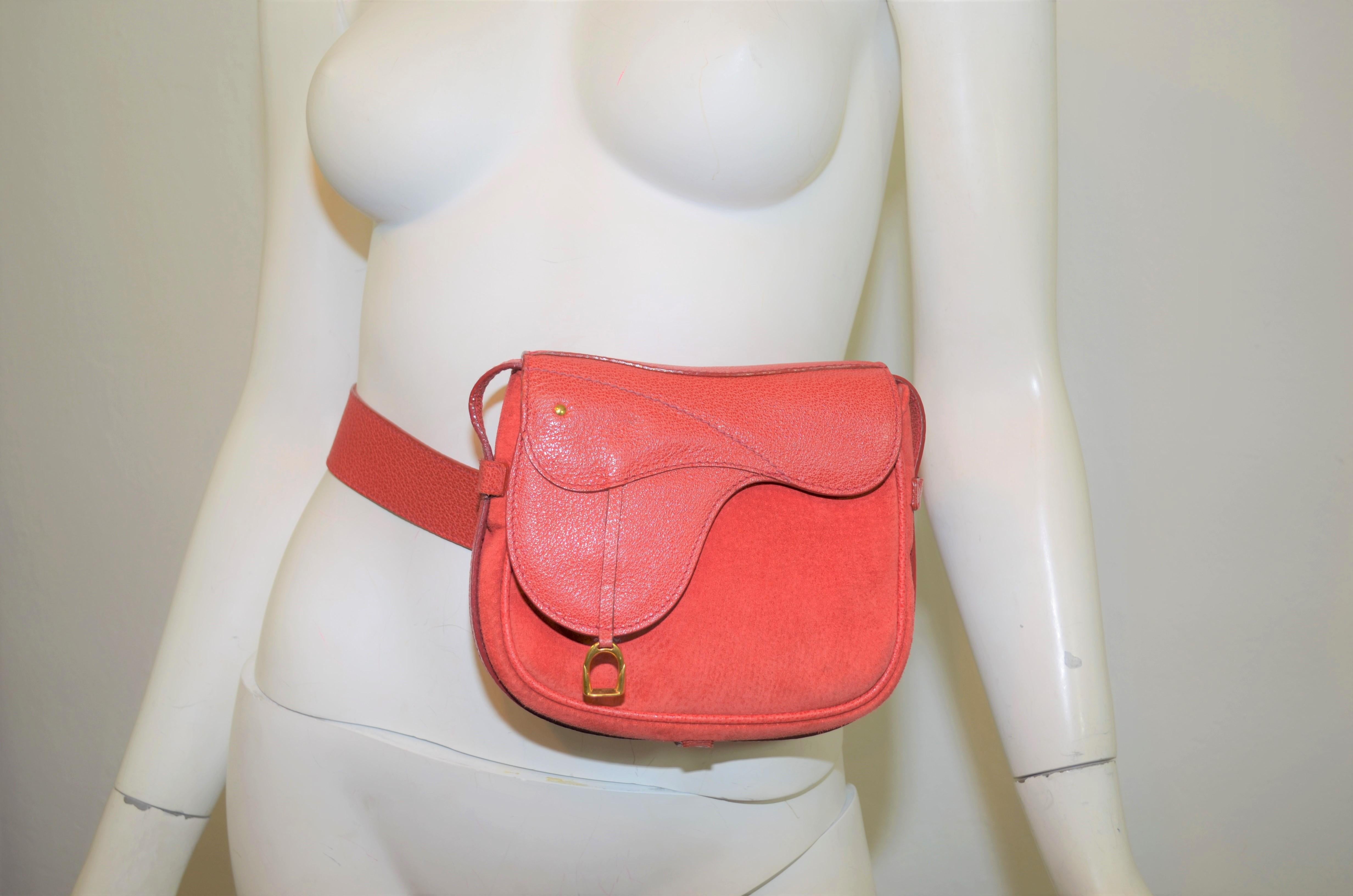 Vintage Gucci bag featured in red suede leather with a saddle design -- Bag can be worn crossbody style as well as a belt bag (shoulder strap can be completely removed), single snap closure at the front and a full jacquard lining. Bag is in great