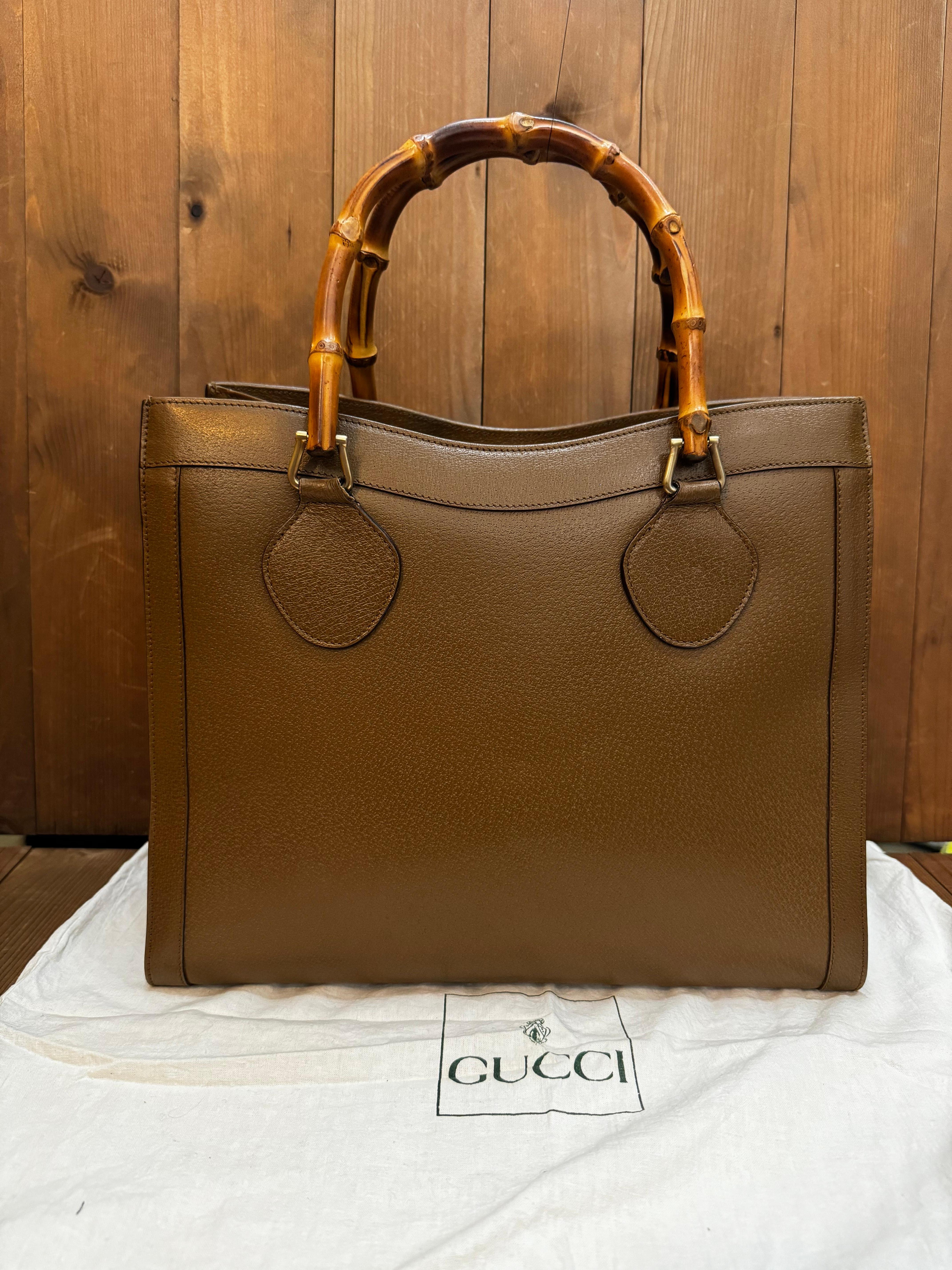 This vintage GUCCI Diana bamboo tote is crafted of pigskin’s leather in brown and brushed gold toned hardware. Top magnetic snap closure opens to Gucci’s iconic diamanté jacquard interior featuring two main compartments/one zippered compartment with