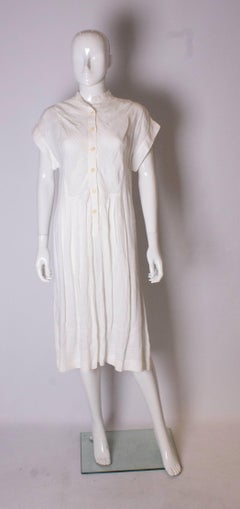 A Vintage 1980s white linen button front day summer dress by Gucci
