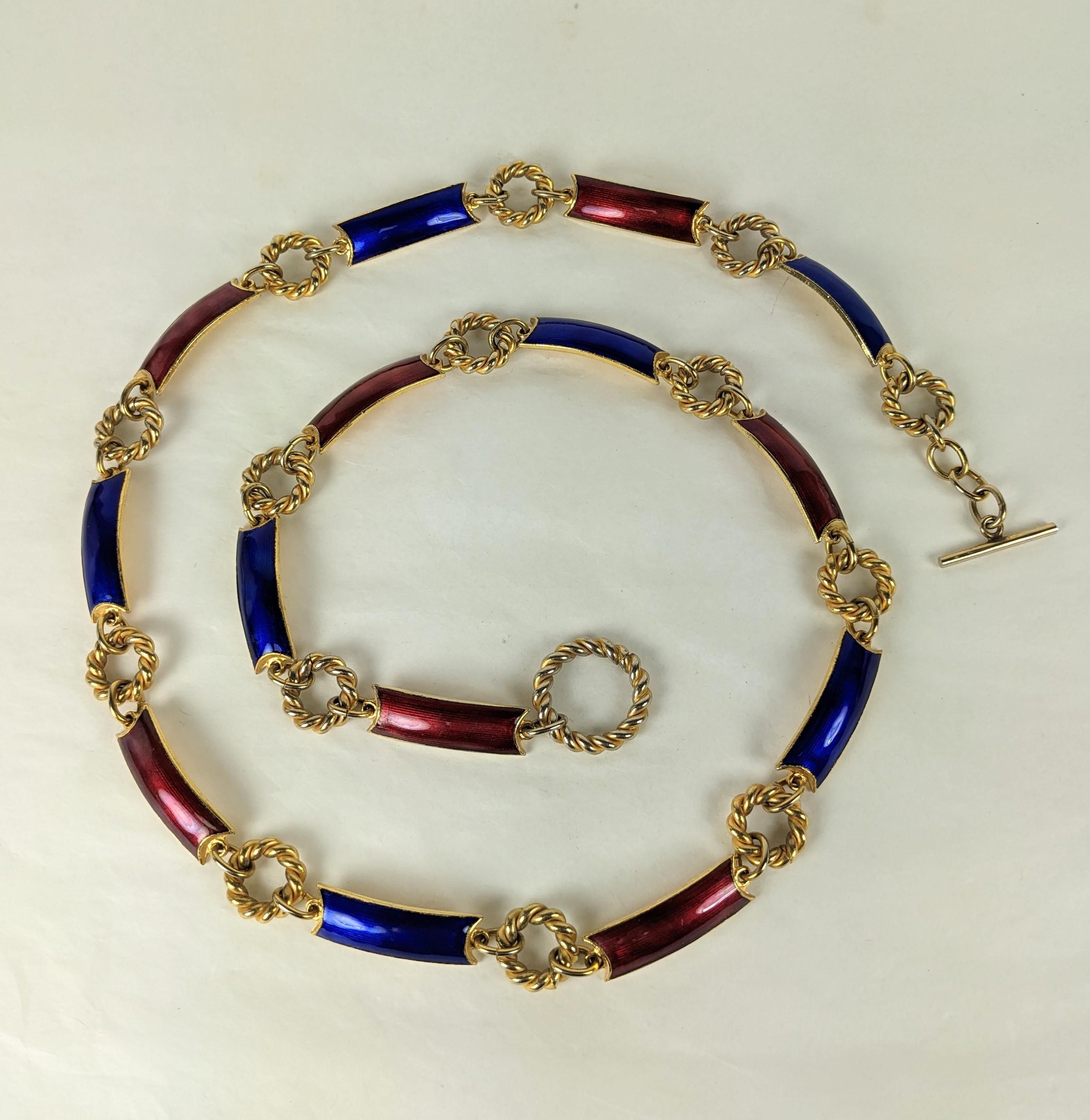 Vintage Gucci Enamel Link Belt from the 1960's. Curved links of gilt metal are enameled in deep blue and burgundy with twisted ring spacers. Signed toggle clasp allows for adjustable sizing. 1960's Italy. 