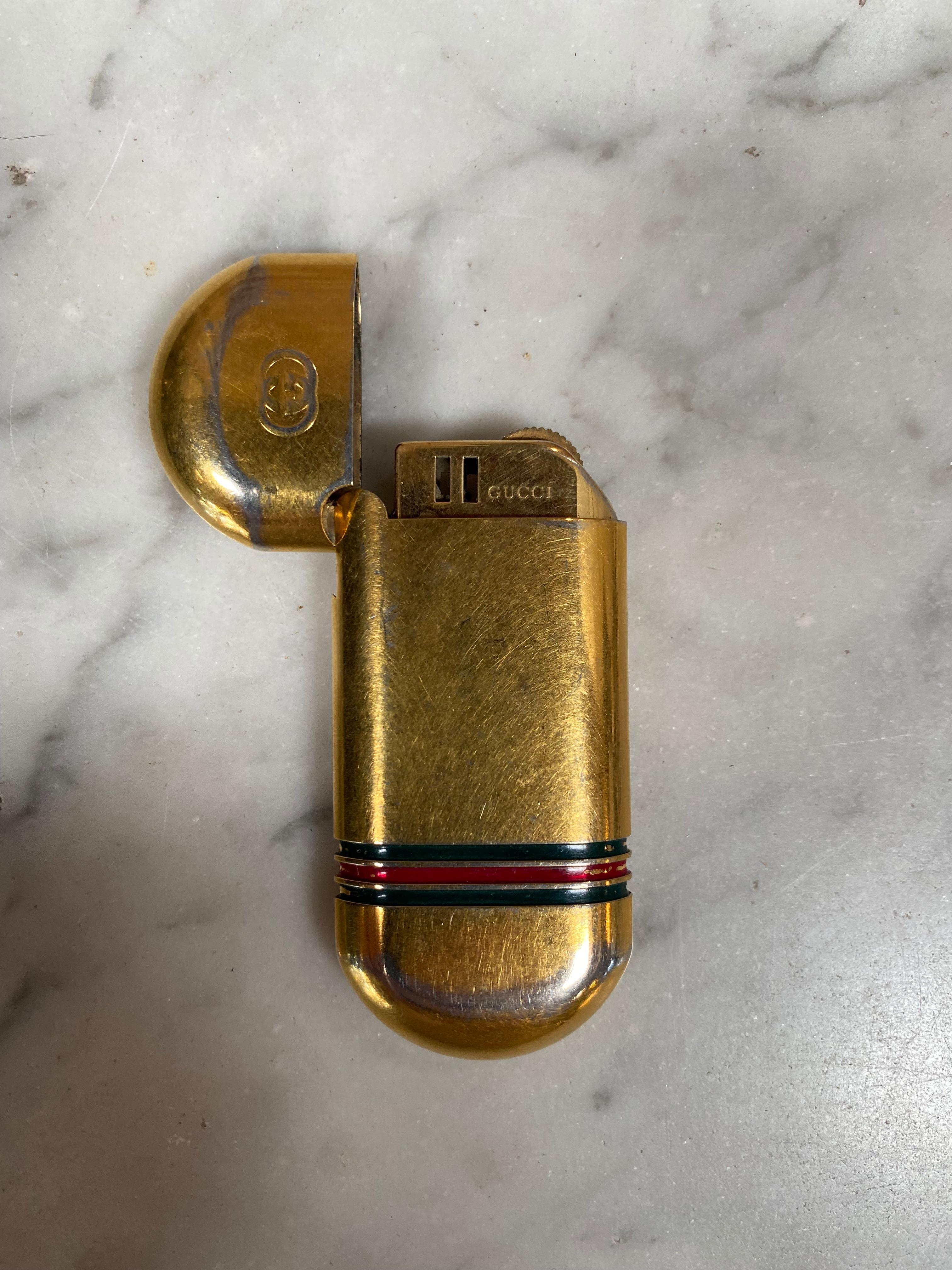 Vintage Gucci gold lighter, 1970s.
 