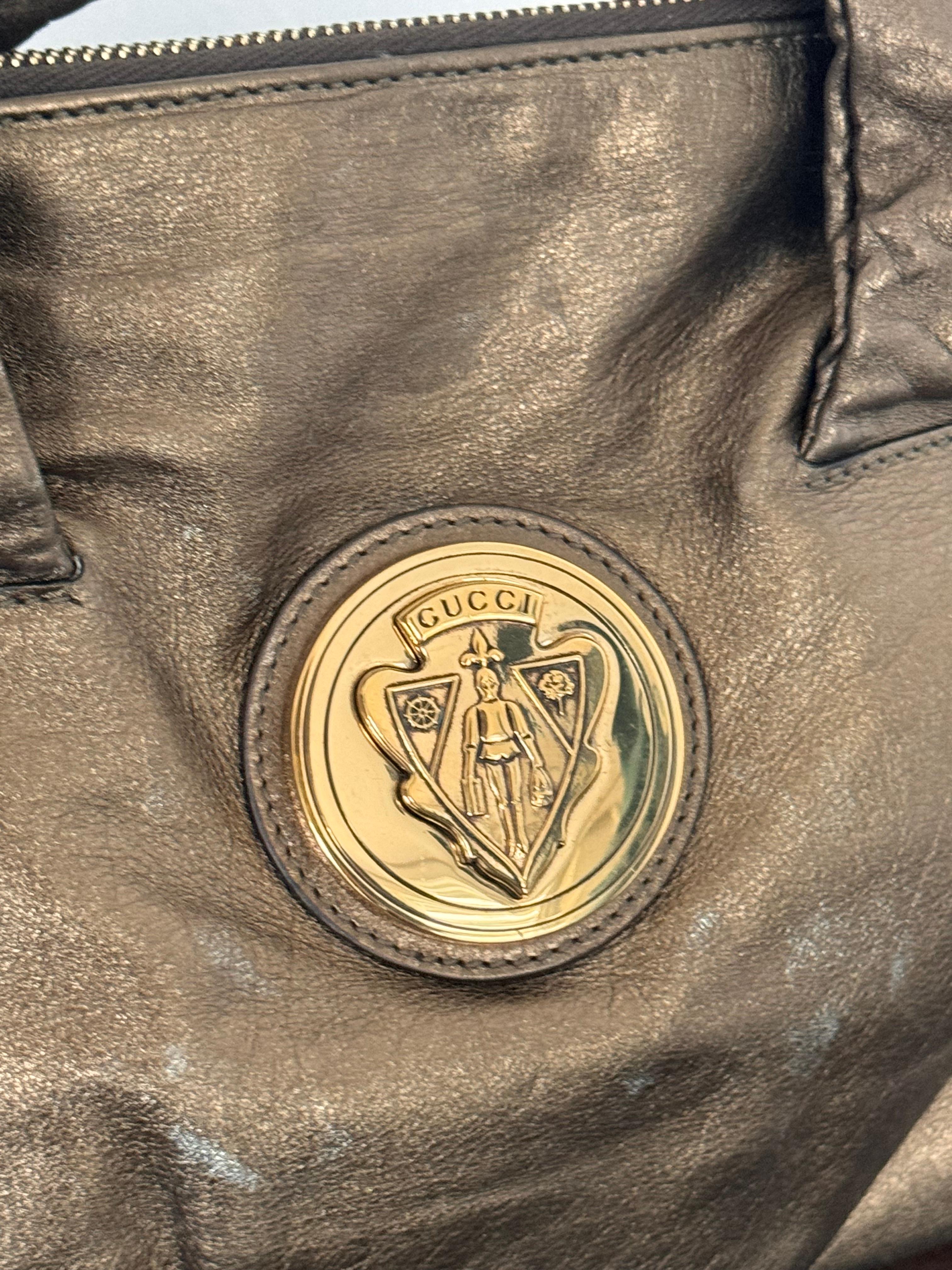 Vintage Gucci Metallic Soft Leather Double Handle Bag

Elevate your style with the exquisite vintage Gucci metallic soft leather double handle bag, a perfect blend of classic elegance and iconic design. This luxurious handbag is a testament to