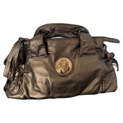 Gold Metallic Vintage Gucci Gold Metallic Tragetasche mit vergoldetem, vergoldetem Knight Gucci Logo