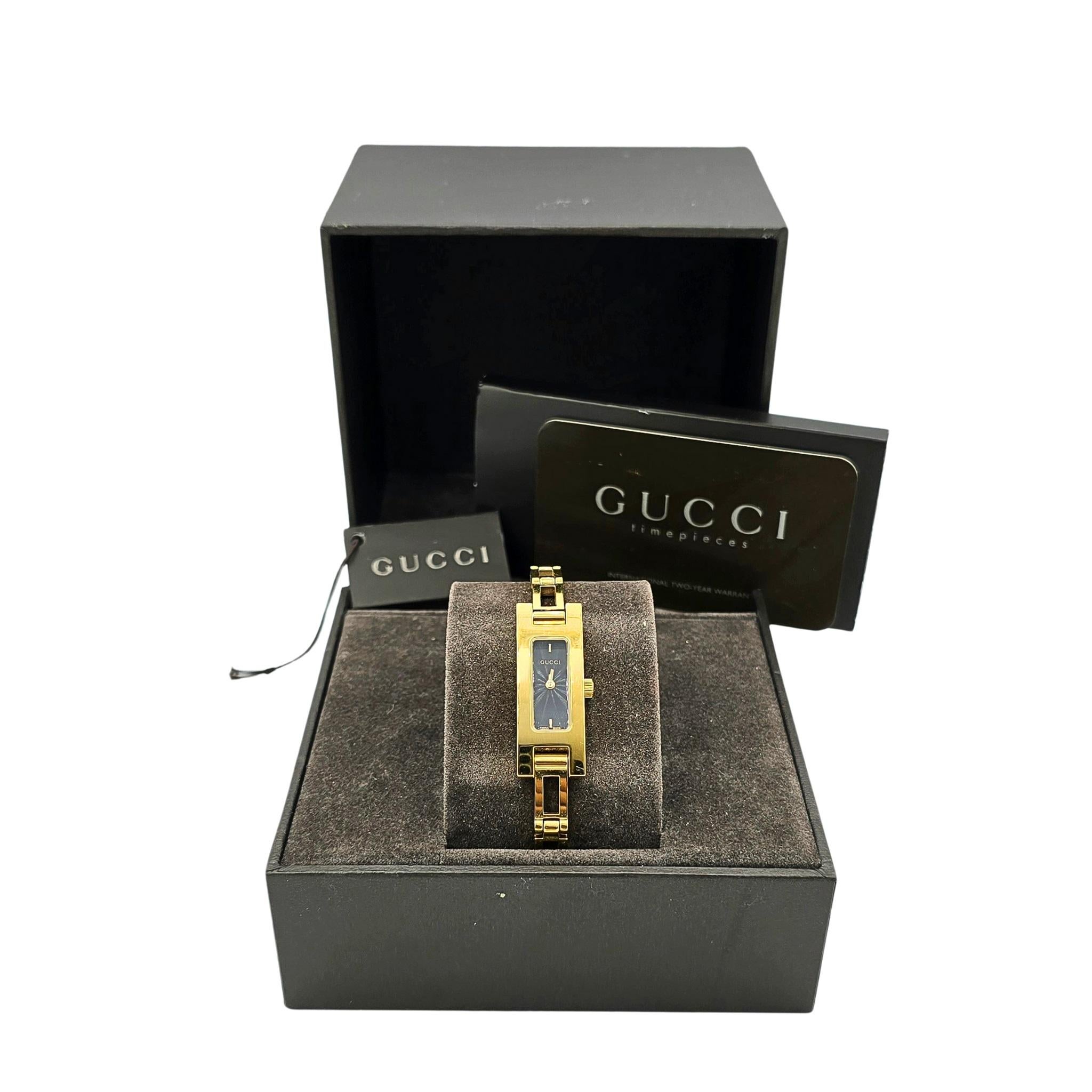 This beautiful Gucci dress watch from the 90's / 00's is in really good condition.  It features a black face with a sunburst pattern that changes with the light.  It has a gorgeous link bracelet.  

The Details:
Model:  3900L
Serial Number: