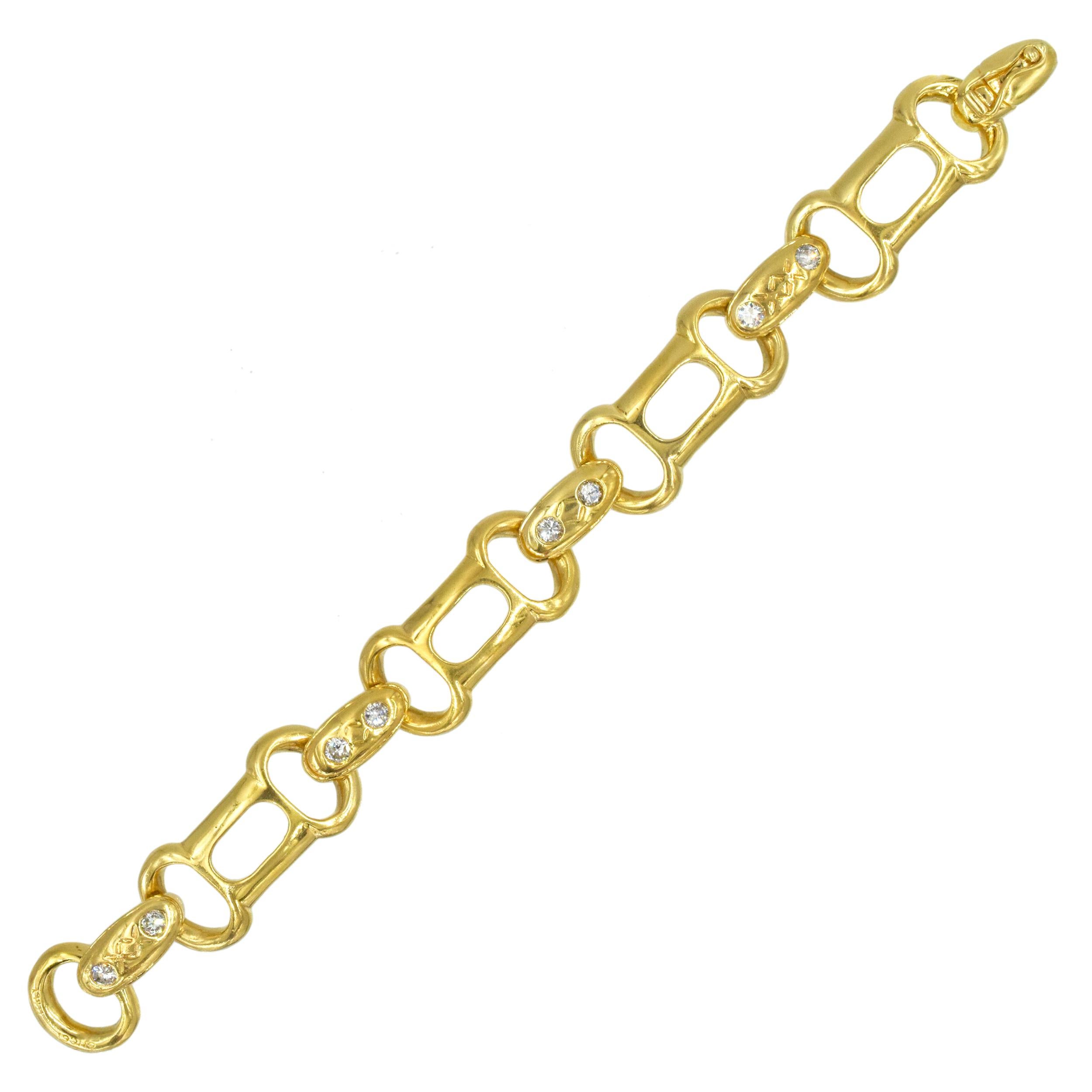 Vintage Gucci 18k yelow gold and diamond Horsebit bracelet. The bracelet features 4
elongated links alternating with 5 oval shape links. Four of the oval links set with two round brilliant cut diamonds, accented with engravings, the fifth link used