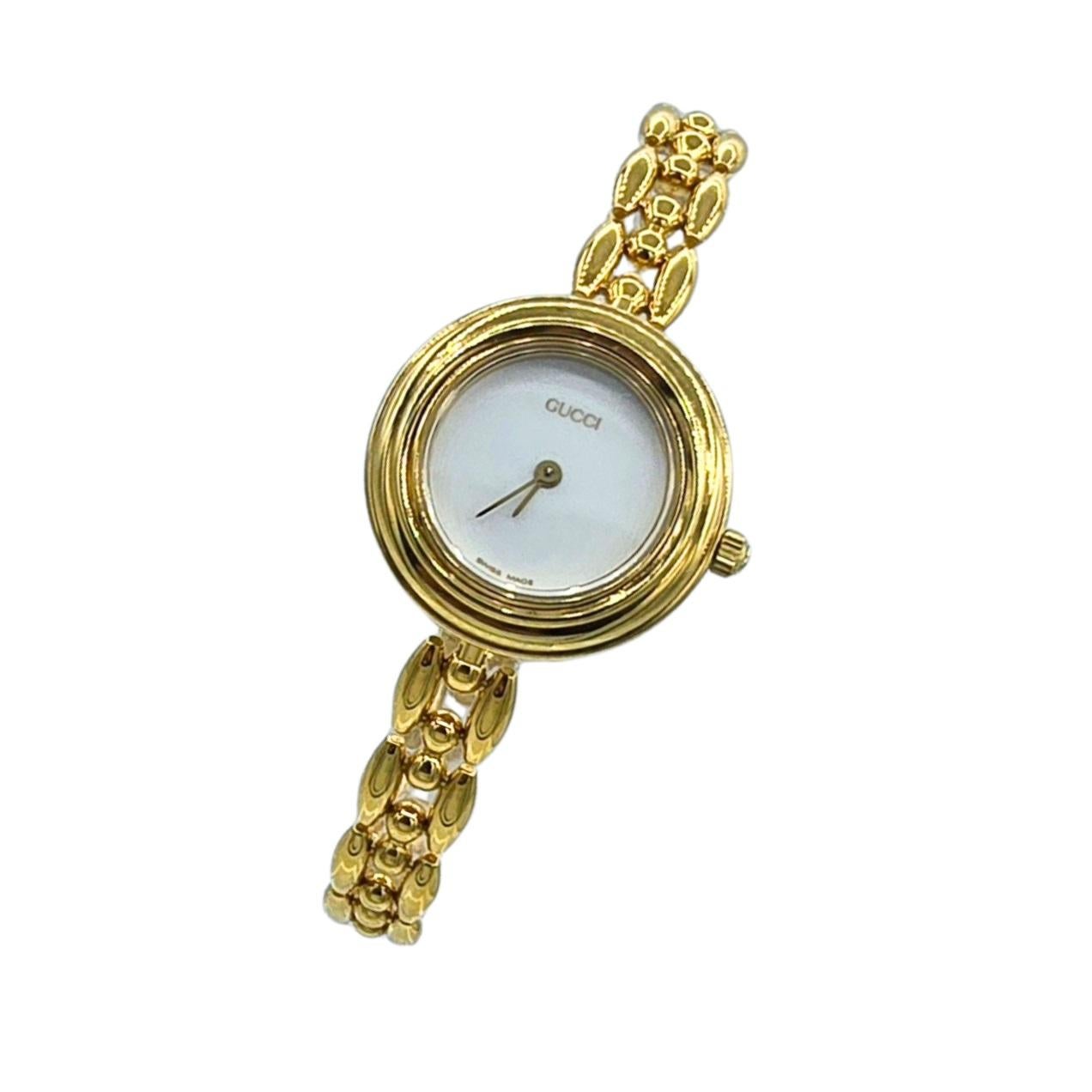 Genuine Vintage Gucci Interchangeable Bezel Gold Plated Watch 1200L with Rice Link Bracelet  Gucci Box and Papers  Birth Year Watch 1995 Near Mint Condition

This is an authentic, vintage Gucci Watch with interchangeable coloured bezels and Gucci's