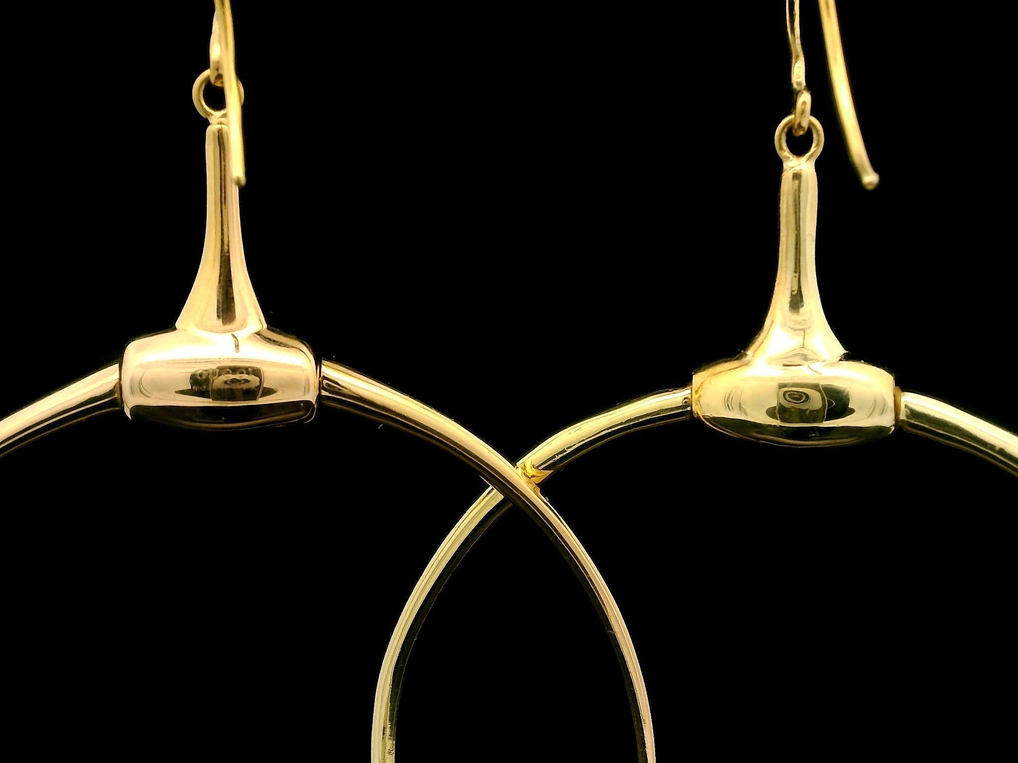 Material: Solid 18k Yellow Gold 
Weight: 22.31 Grams
Backing: Wire Hook w/ Plastic Stoppers (pierced ears are required)
Overall Height: 80.7mm (3.1