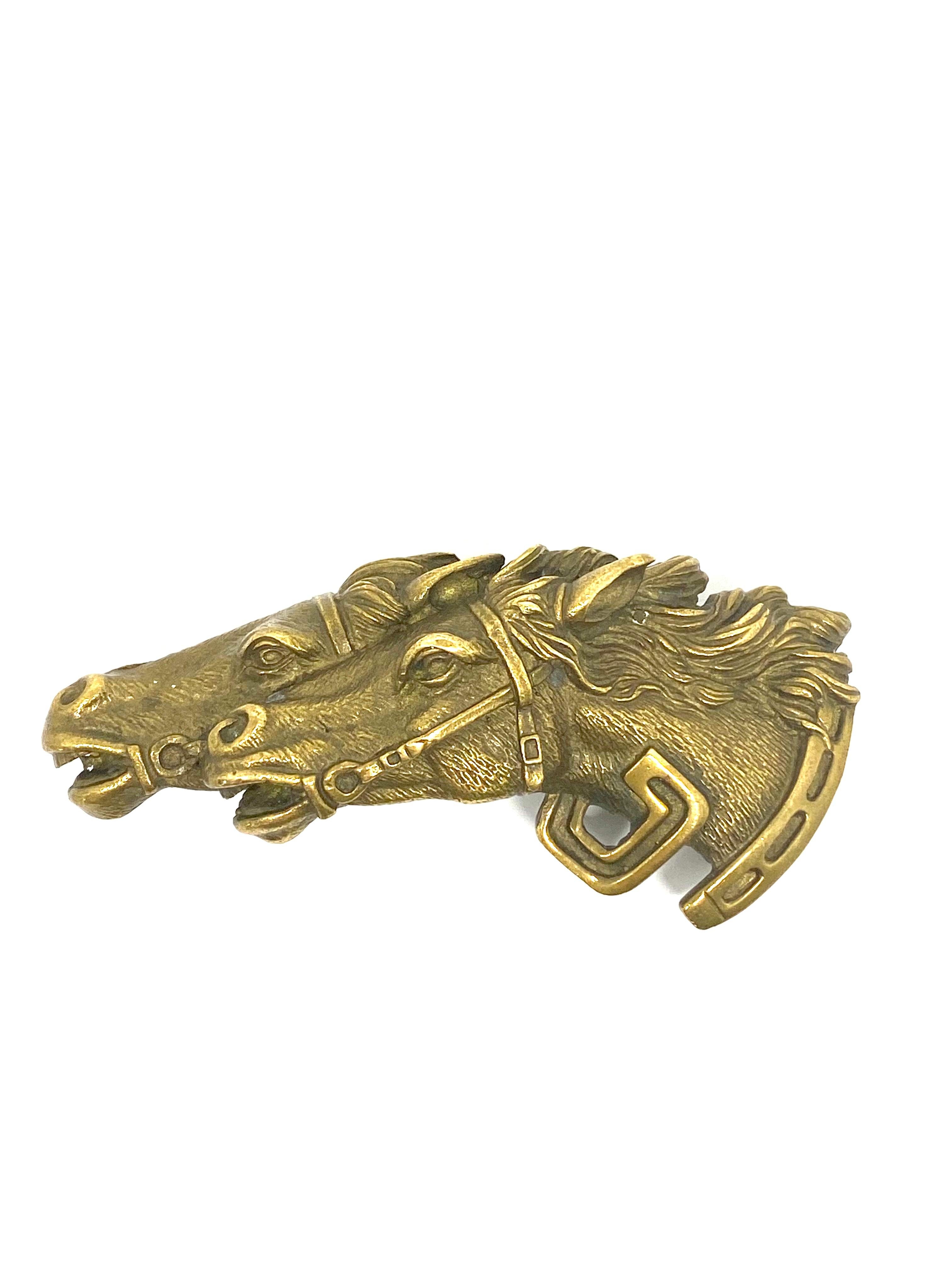 
Vintage GUCCI Italy Double Horse Head Bronze Belt Buckle

Product details:
Bronze
Circa 1970
Hallmarks: GUCCI Italy
Made in Italy
Fits 1” wide belt
Total weight is 48.0 g.
