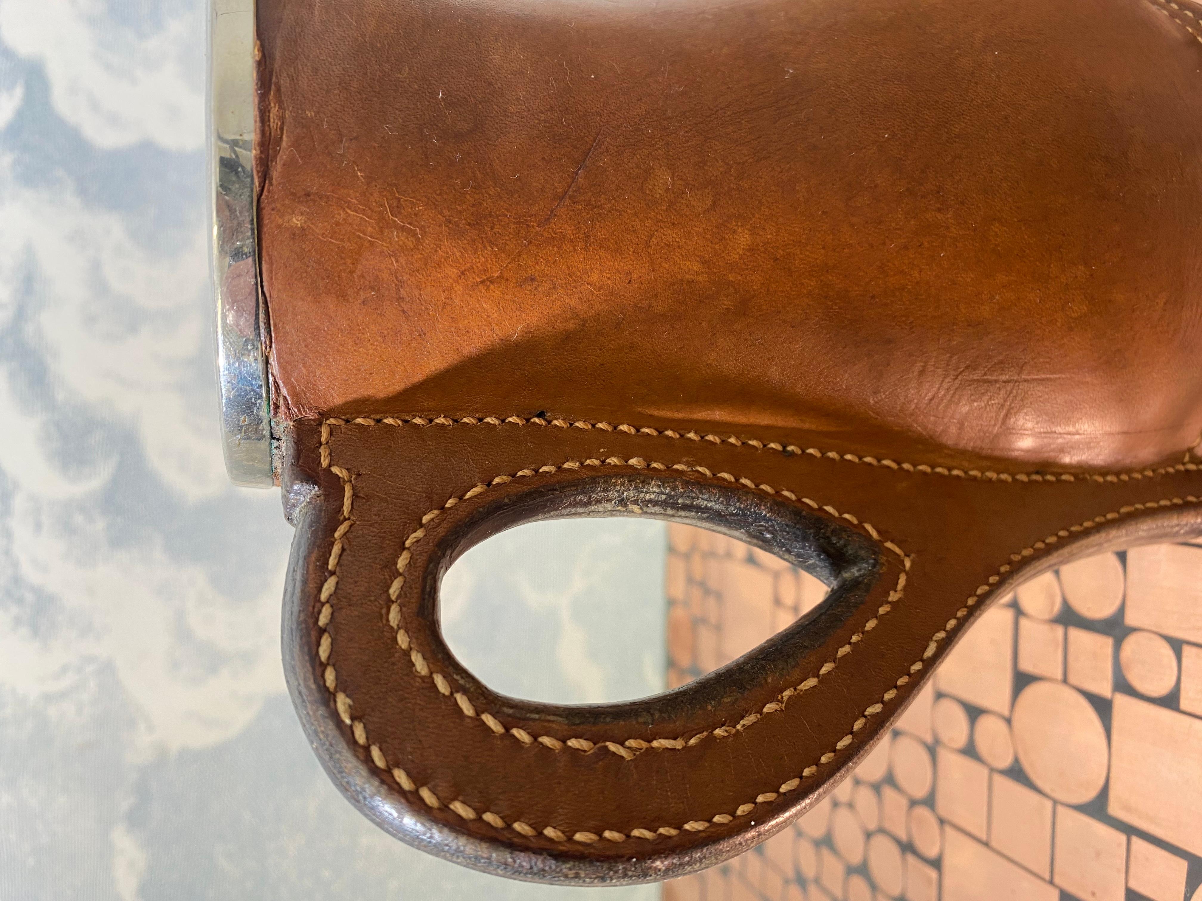 We acquired this leather jug with saddle stitching and metal insert from an elderly lady in Munich who told us that it was already in her father's collection when she was a child.

Stamped with 