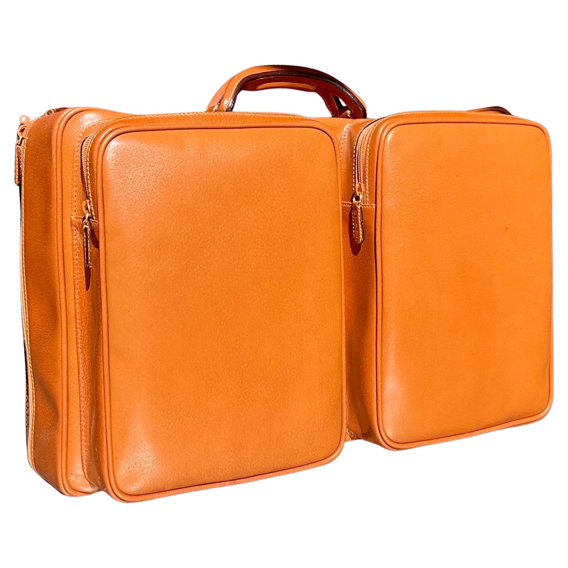 This vintage Gucci leather travel bag with the original box is a coveted luxury item that combines both timeless style and functionality. Gucci, a renowned Italian fashion house, is famous for its impeccable craftsmanship, premium materials, and