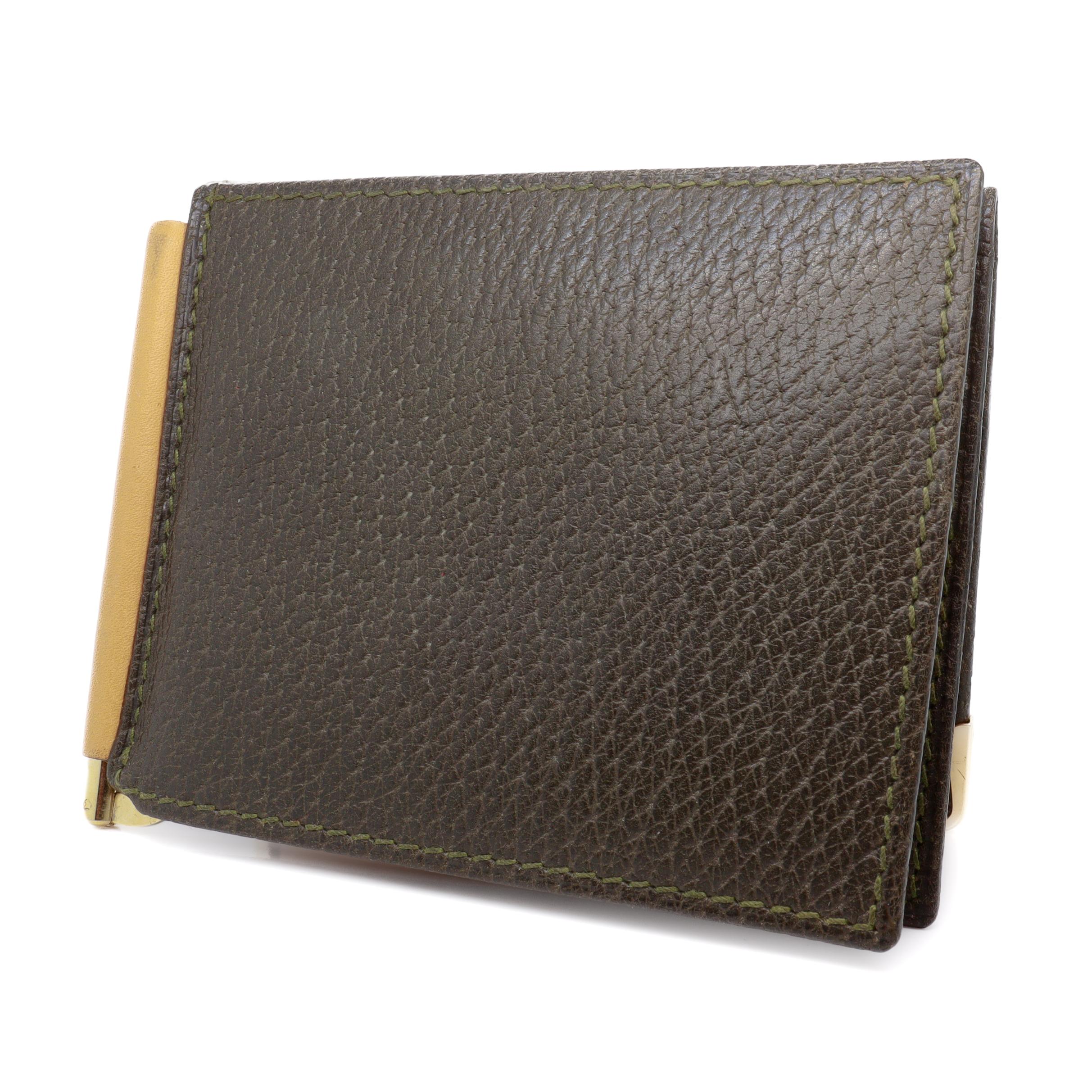 A fine vintage signed ltalian designer leather wallet.

By Gucci. 

In leather with gold-plated accents. 

In the form of a trifold wallet with a money clip. 

Marked to the interior with Gucci / Italy and a 'BGM' monogram. Marked to the gold-plated