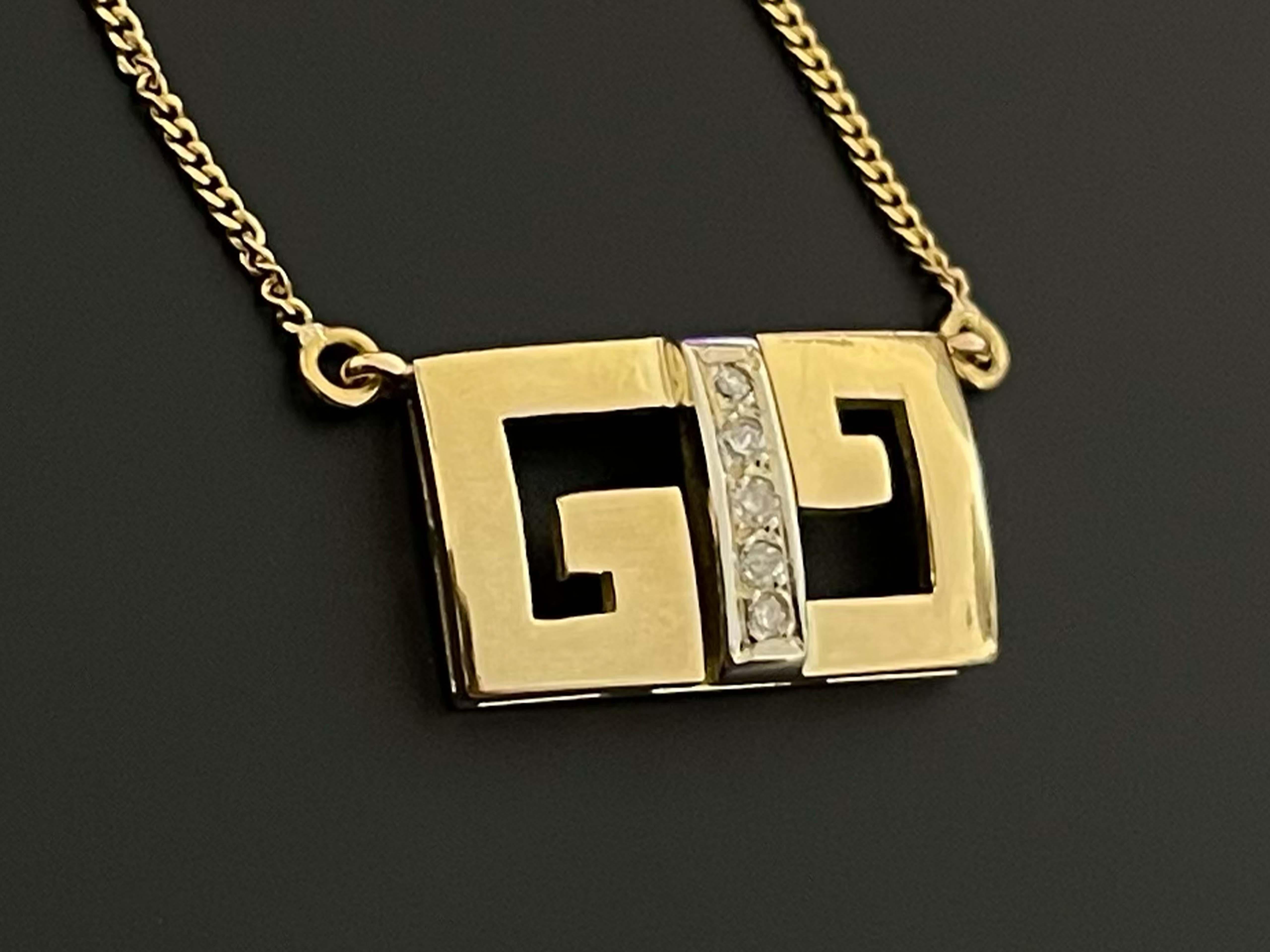 This 1970's Gucci necklace is from the Gucci Logo Collection and is a piece that takes you back in time. Gucci's signature logo GG is connected by a row of 5 vertical diamonds. These round diamonds total 0.05 carats and are I-J in color and I1 in