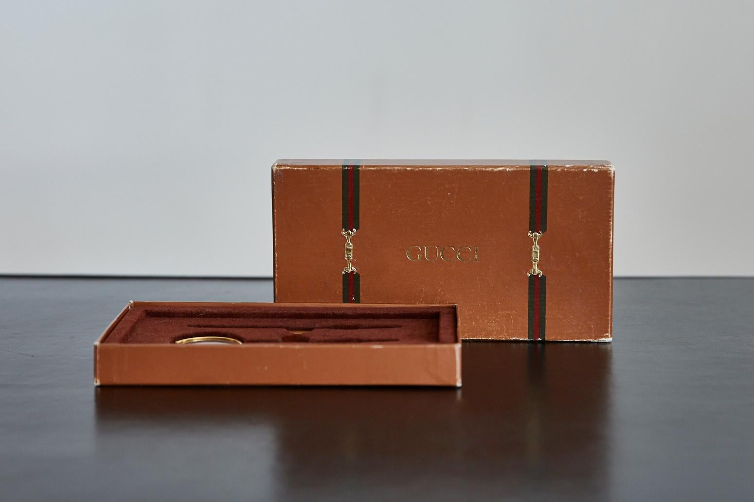 Great vintage Gucci magnifying glass and letter opener set. Made of polished brass in excellent vintage condition. Comes with original box. Great gift idea!