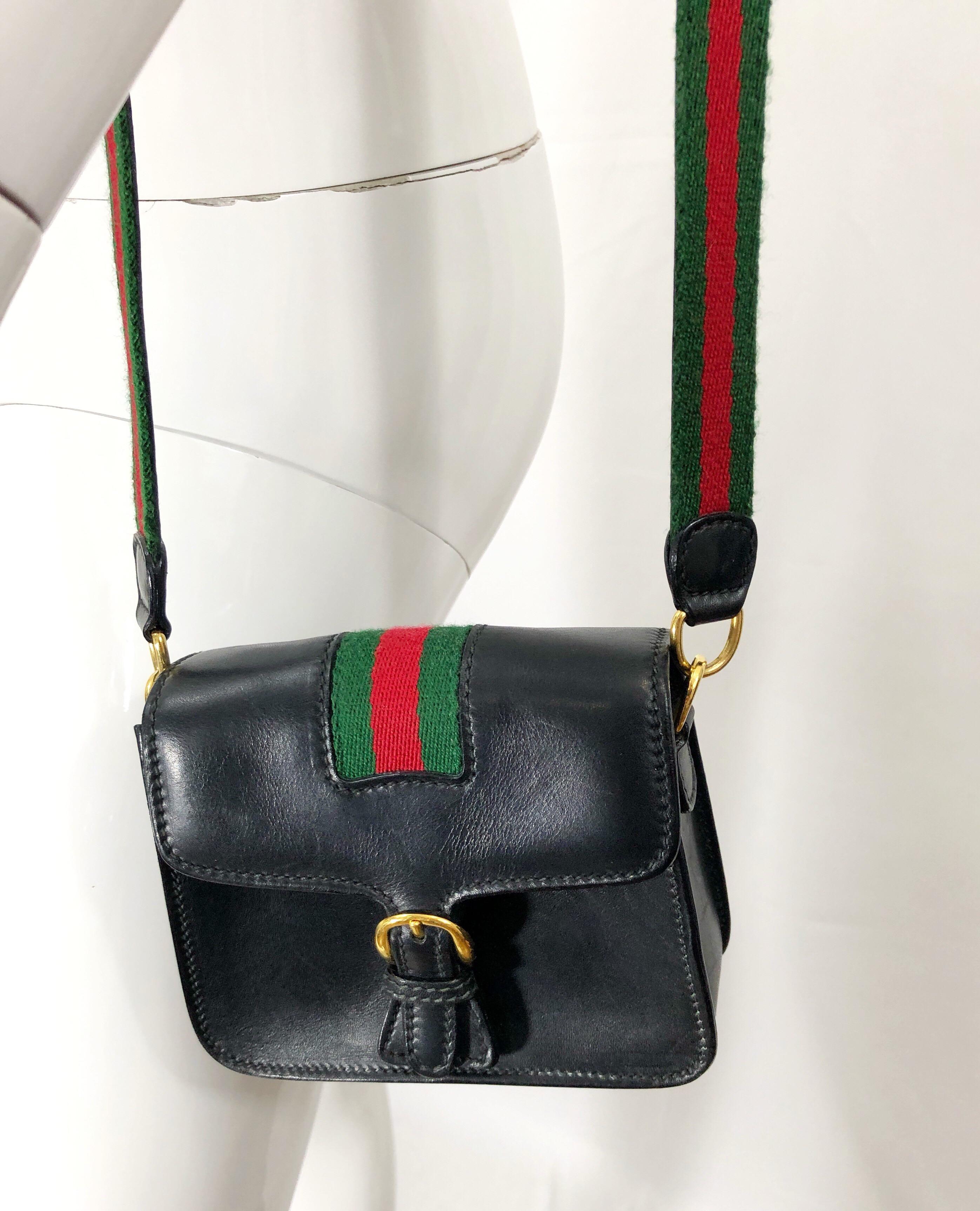 Rare vintage mid 90s GUCCI black leather miniature crossbody / shoulder bag! Features signature green and red striped cloth strap. Snaps shut with flap on front. Great for everyday use, or for evening. In godd condition, with wear to the lining,