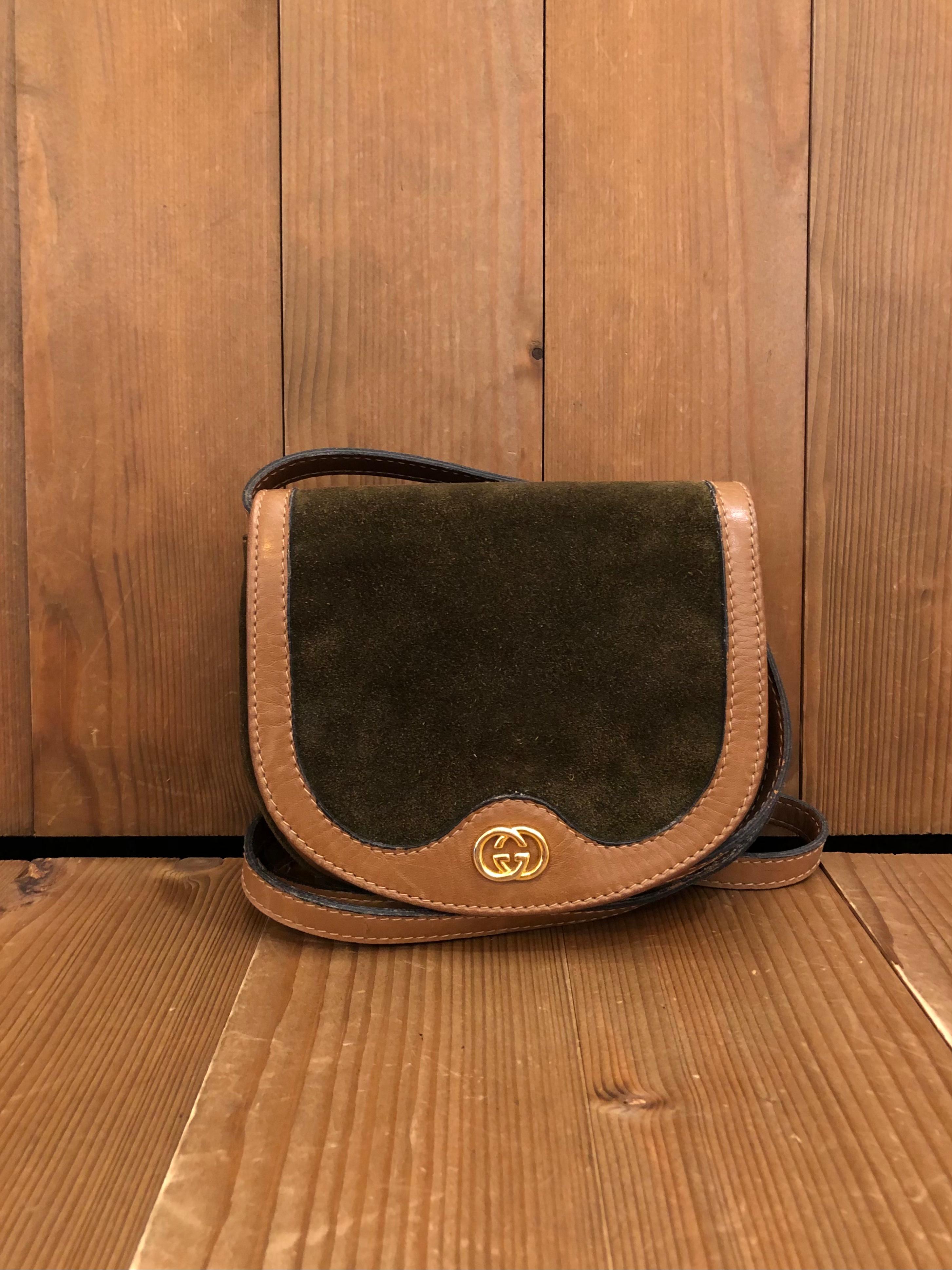 This vintage GUCCI mini crossbody bag is crafted of suede and calf leather in brown featuring gold toned hardware. Font flap snap closure opens to Gucci’s diamanté jacquard interior in brown. Made in Italy. Measures approximately 6.5 x 5.5 x 1.25