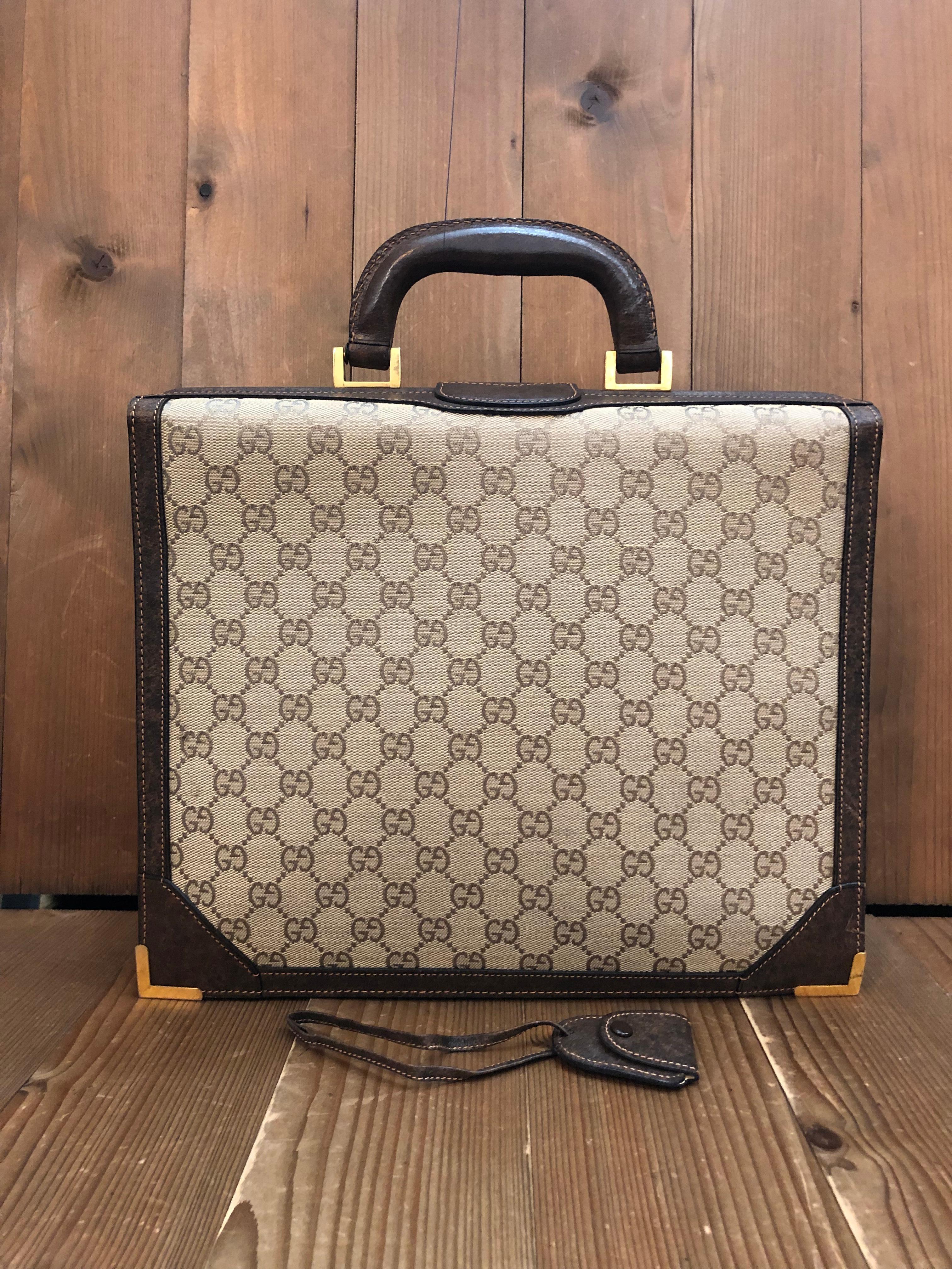 This vintage GUCCI small sized briefcase is crafted of monogram jacquard in brown featuring dark brown pigskin leather and gold toned hardware. Too push lock closure opens to three separate compartments lined with smooth leather in beige featuring
