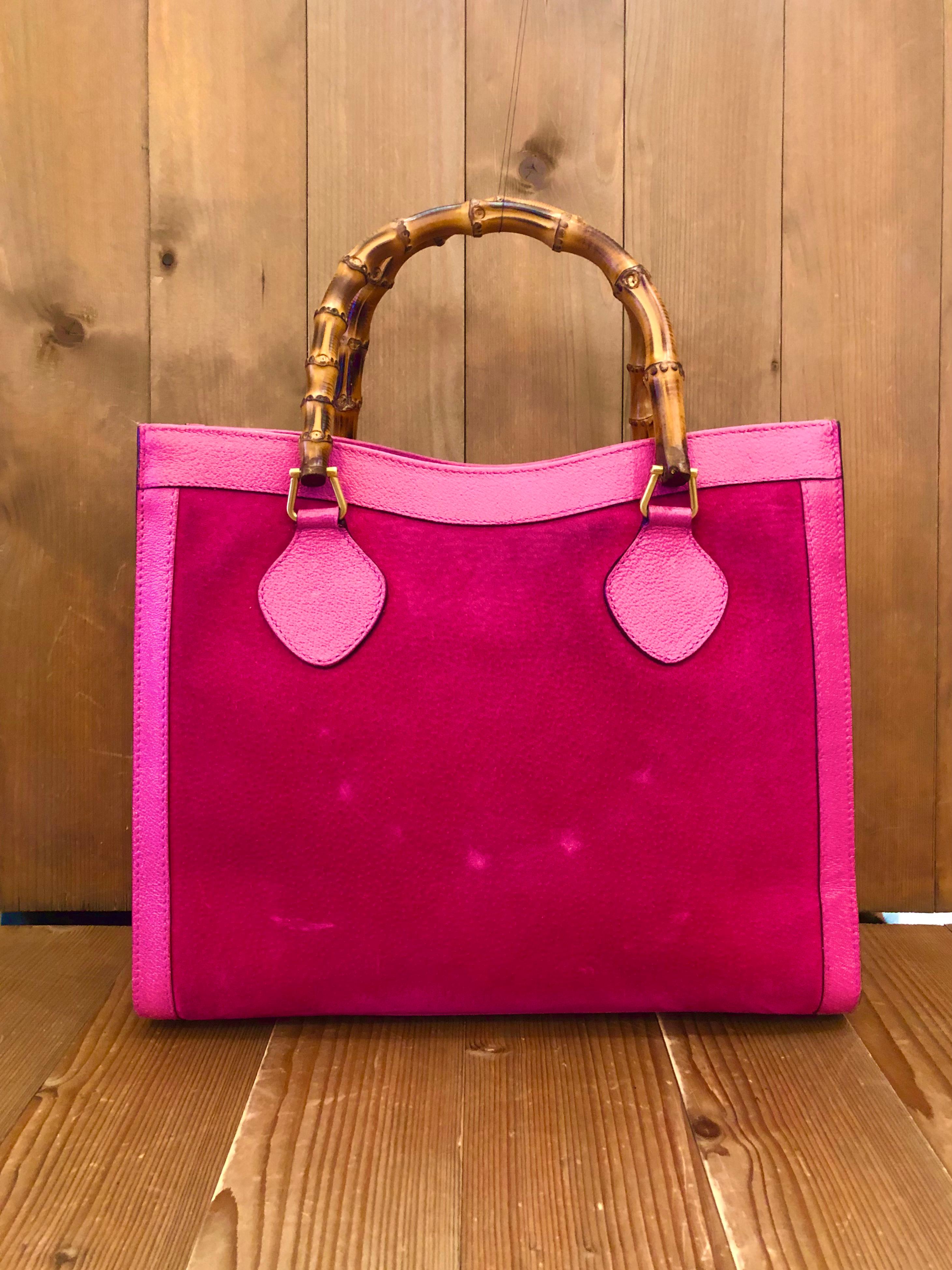 This vintage GUCCI Diana bamboo tote is crafted of pigskin’s leather and suede in hot pink and matt gold toned hardware. Top magnetic snap closure opens to a new interior in beige. It features two main compartments with one zippered compartment in