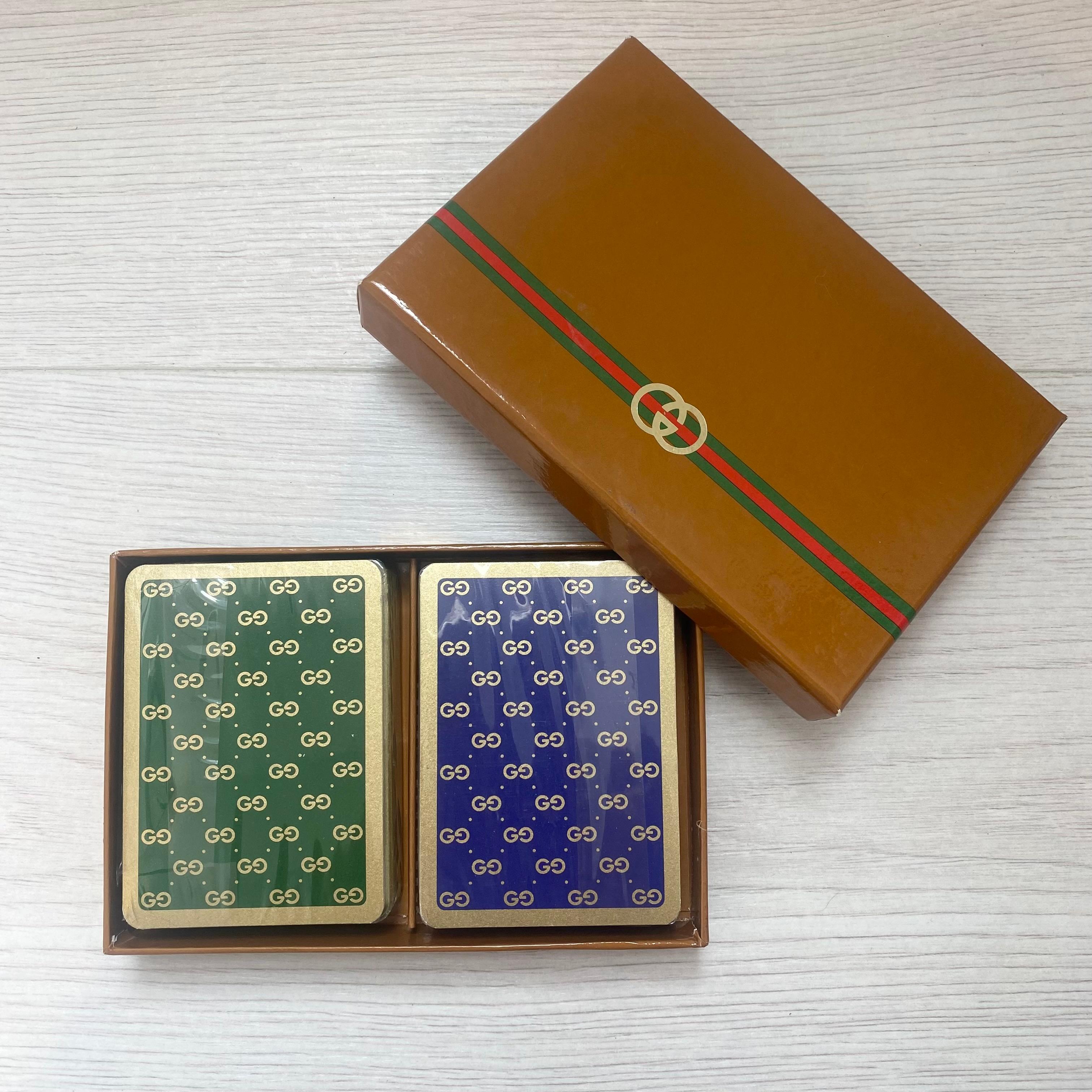 Rare Gucci playing cards in the original box. Cards are plastic and washable. Two complete decks with two jokers and a bridge card in French. Both sets still sealed in plastic and un-used. Makes a perfect gift for the Gucci collector. 