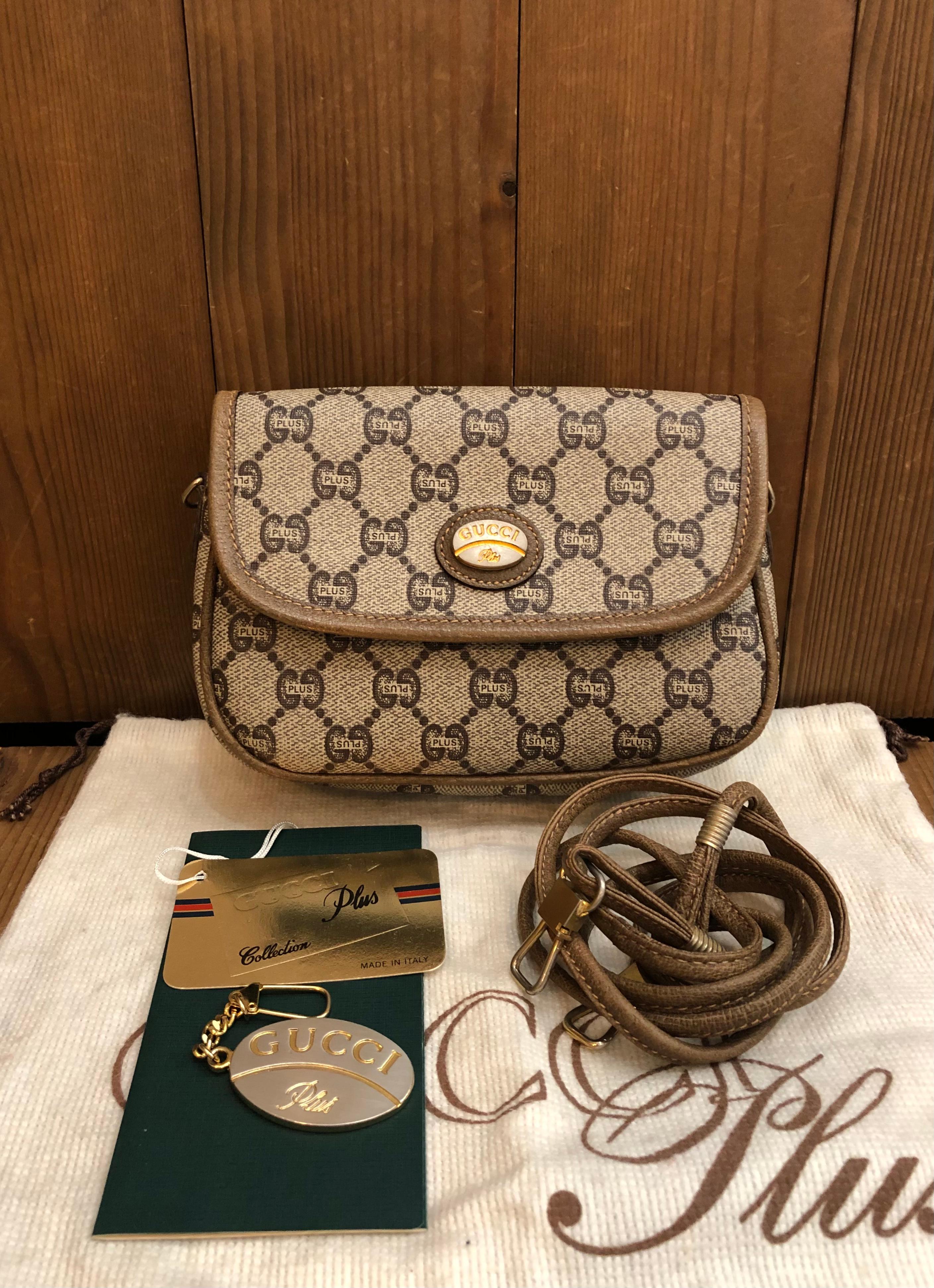 This vinatge GUCCI Plus mini crossbody bag is crafted of GG Plus monogram canvas and pigskin leather in brown. Front flap magnetic snap closure opens to a coated interior which has been professionally cleaned. This vintage Gucci Plus also comes with