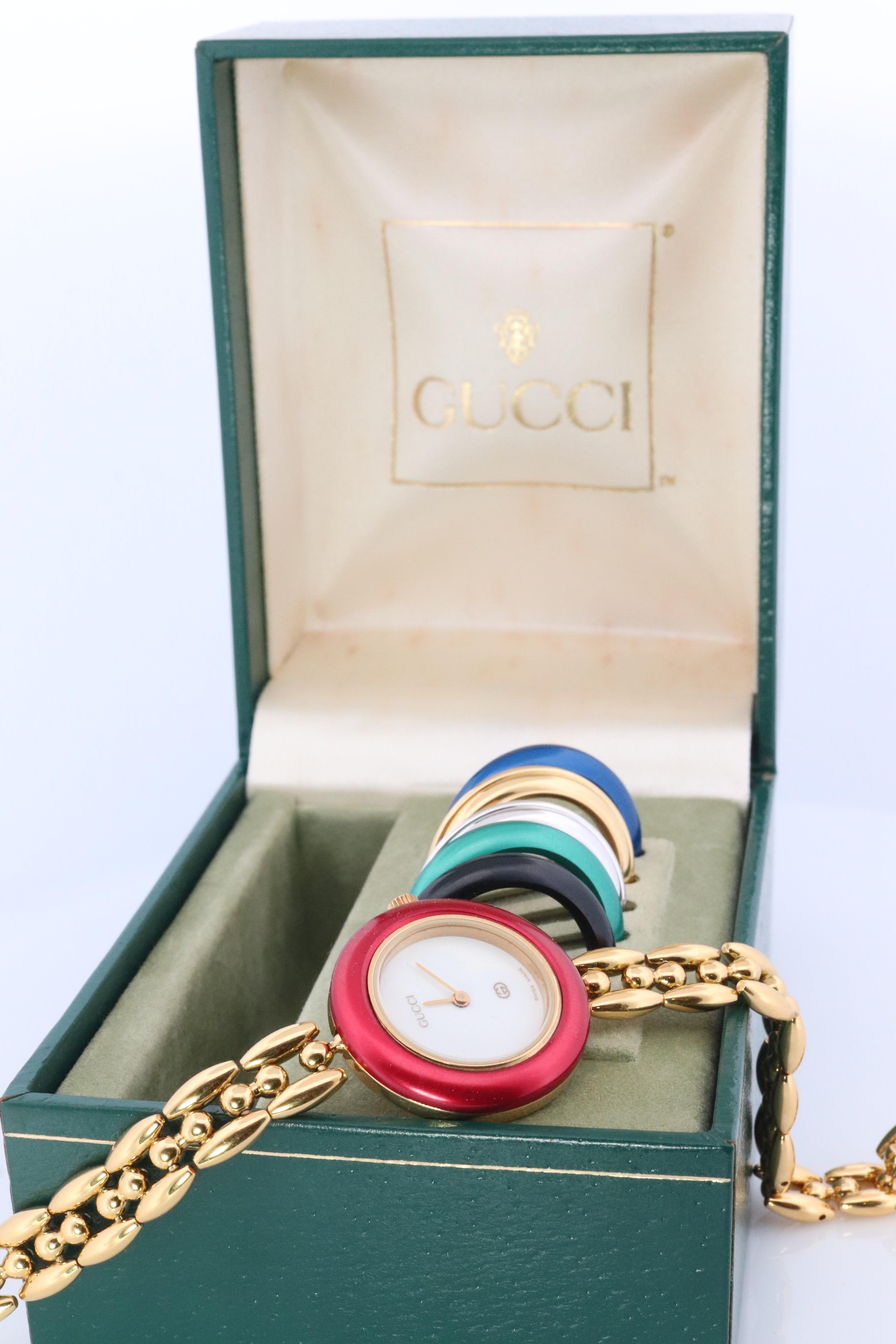 Genuine Gucci Watch with Original Box

11/12 Reference number.

Gold White Tone with interchangeable bezels.

Chain link bracelet. Gold plated. 

Condition: New battery. Original Box. Pictured.


Details:
26mm round Case
7.5in wrist. Can be easily