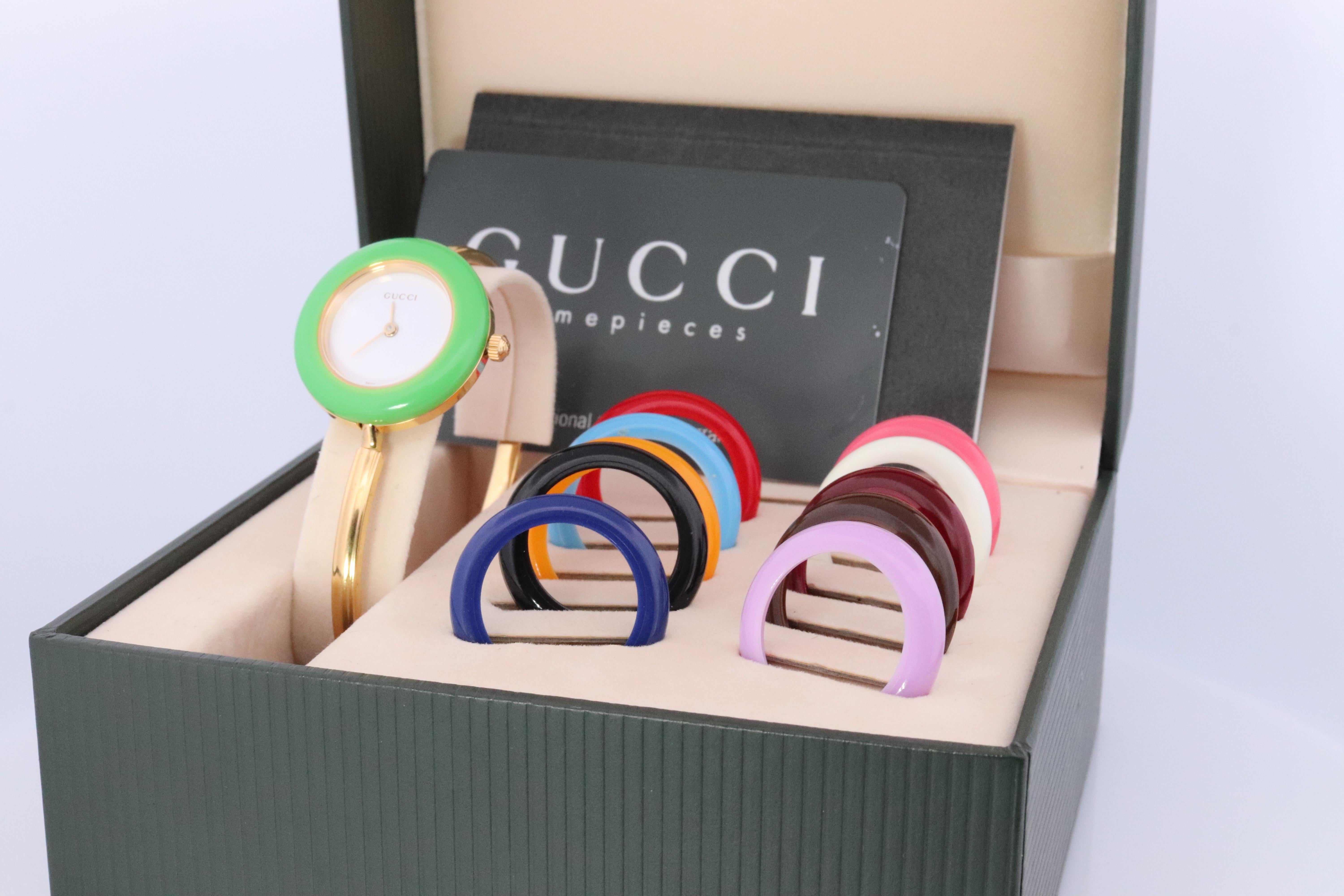 Genuine Gucci Watch.

11/12.2 Reference number.

Gold Tone with interchangeable bezels.

Original Box with Paperwork included.

Condition: New battery. Comes with original box and original bezels. Please review photos for colors.


Details:
26mm