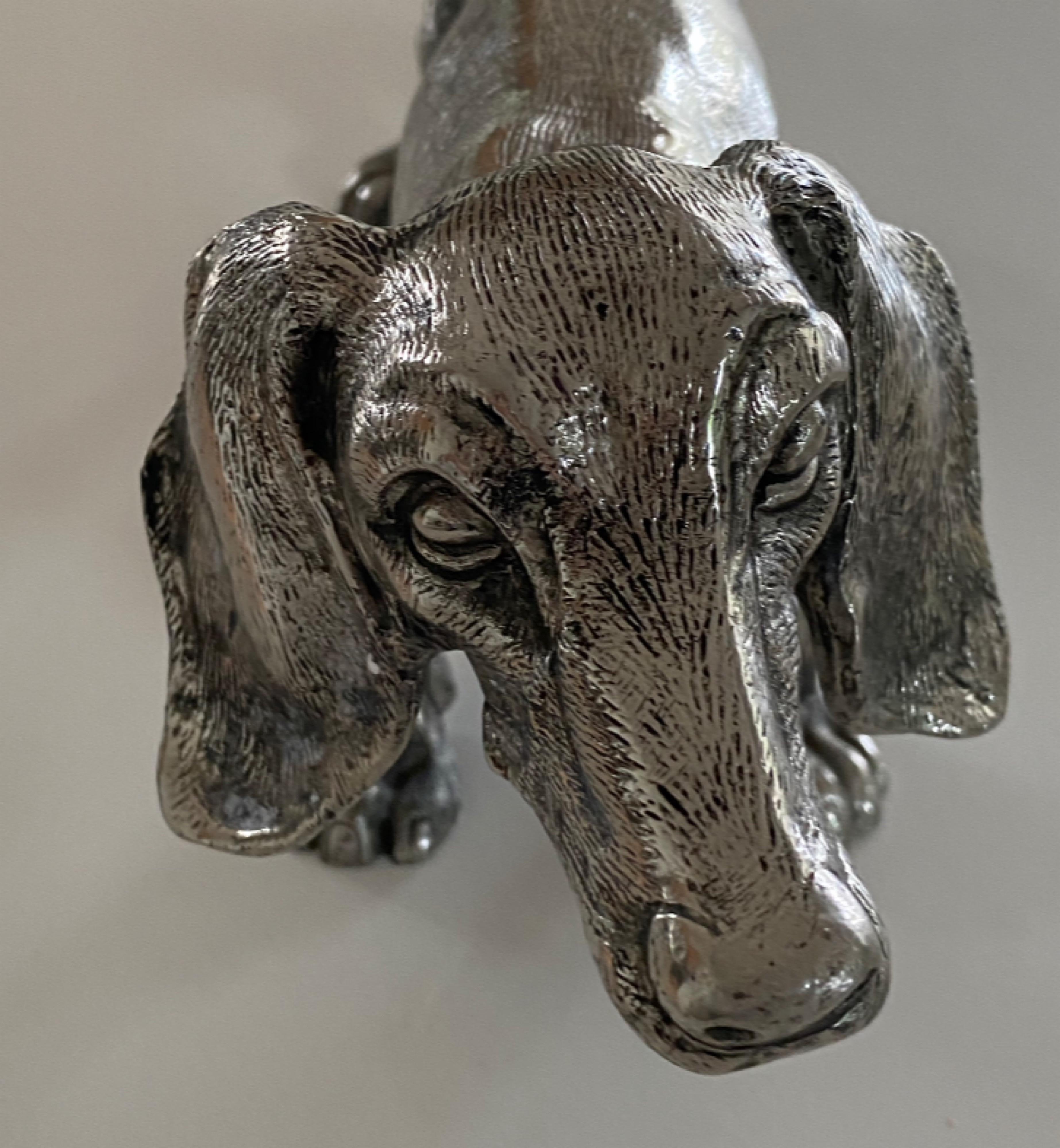 Silver-plated Gucci Dachshund  Dog Sculpture from the 1970s. Handcrafted in Italy. Great vintage Gucci collectible. Stamped Gucci and made in Italy on the bottom. This chic pup would be a nice addition to a bookcase or as coffee table decor. Want to