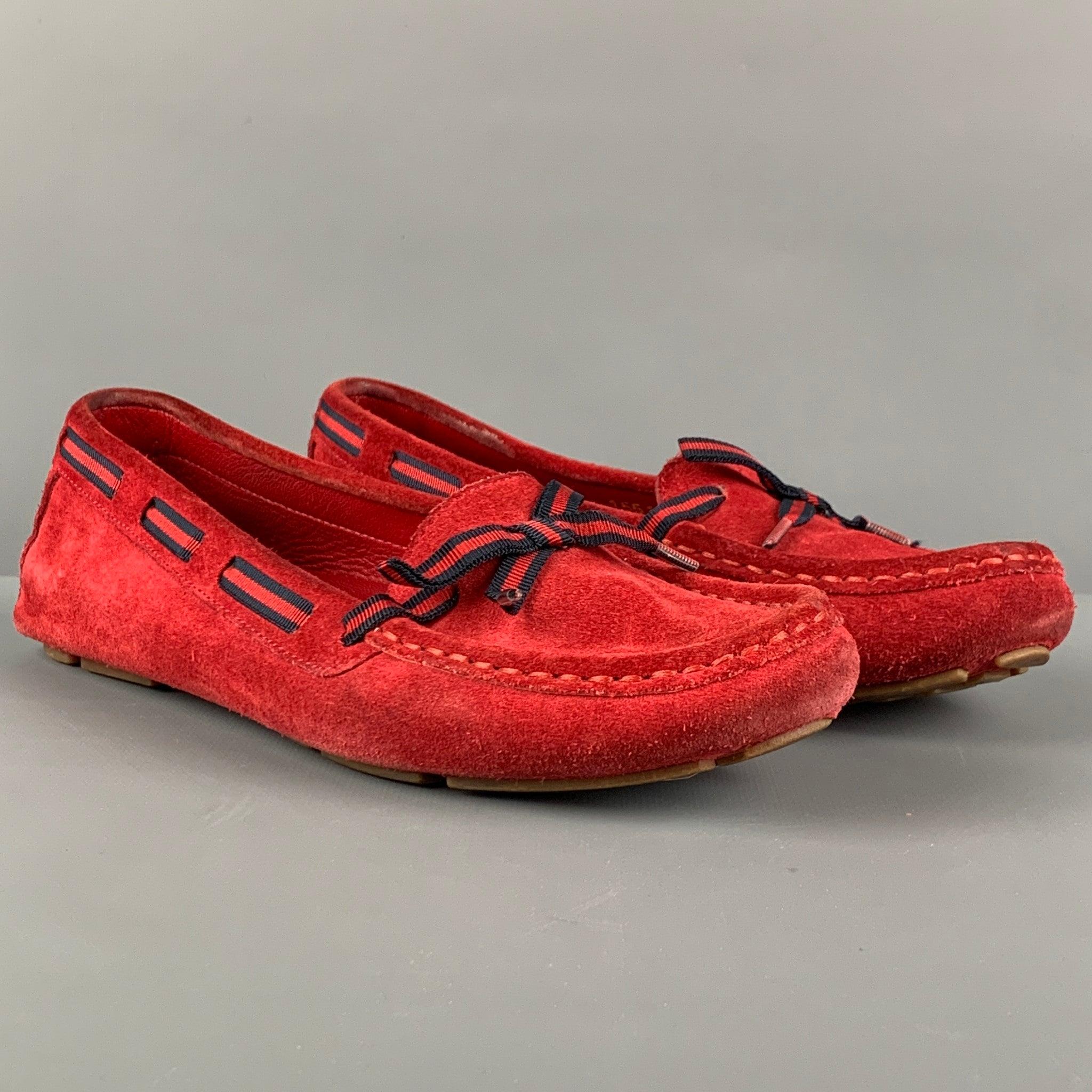 Vintage GUCCI flats comes in a red suede featuring a stripe ribbon bow detail and a drives sole. Made in Italy.Good
 Pre-Owned Condition. Light wear. 
 

 Marked:  7 B Outsole: 10 inches x 4 inches 
  
  
  
 Sui Generis Reference: 117400
 Category: