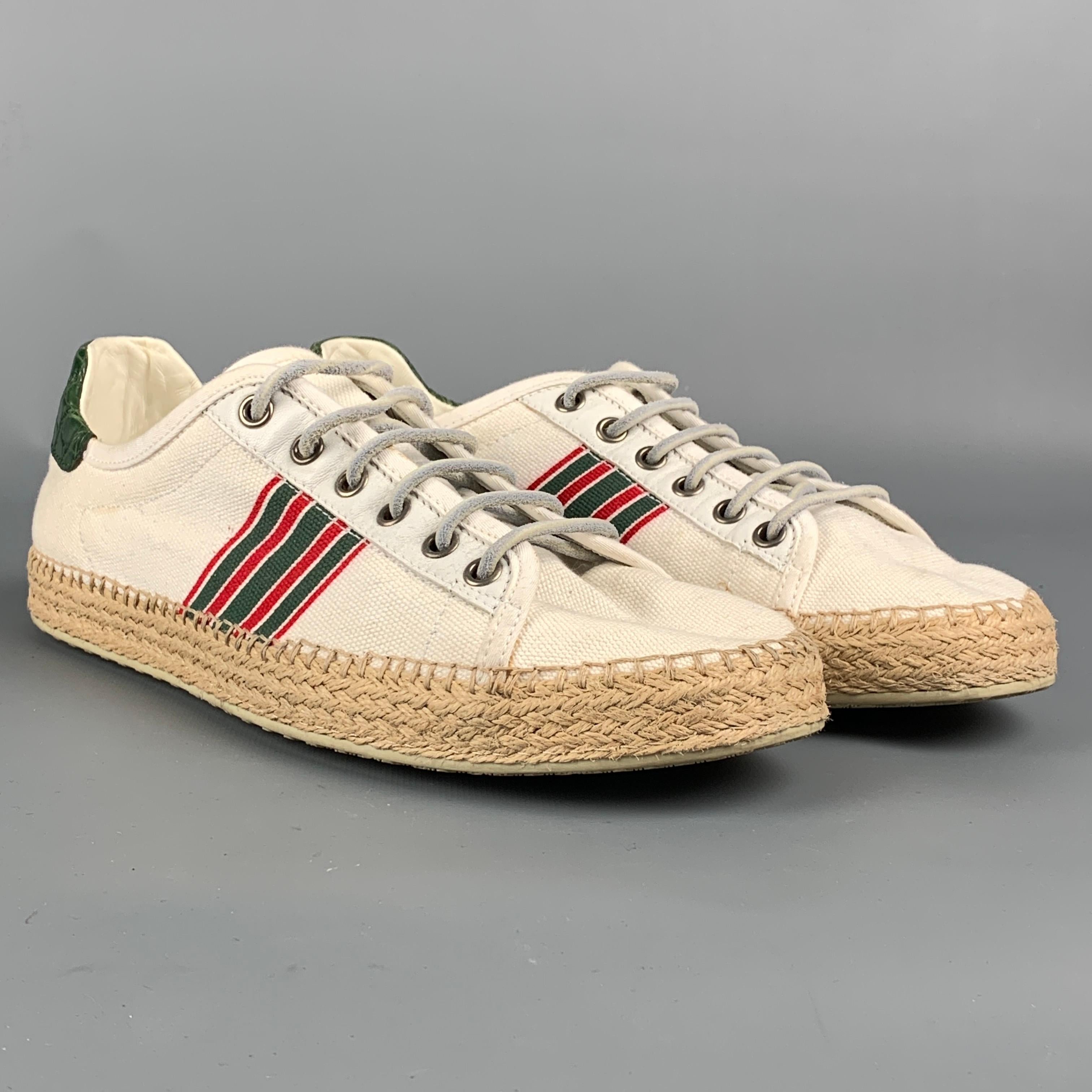 Vintage GUCCI sneakers come in a multi-color canvas featuring espadrille trim, rubber sole, and a lace up closure. Made in Italy. 

Good Pre-Owned Condition.
Marked: 308235 7.5 G

Outsole: 11 in. x 4 in. 