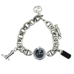 Gucci, montre-bracelet vintage en acier inoxydable avec breloques, modèle 107