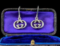 Orecchini pendenti vintage Gucci in argento sterling, con le G intrecciate