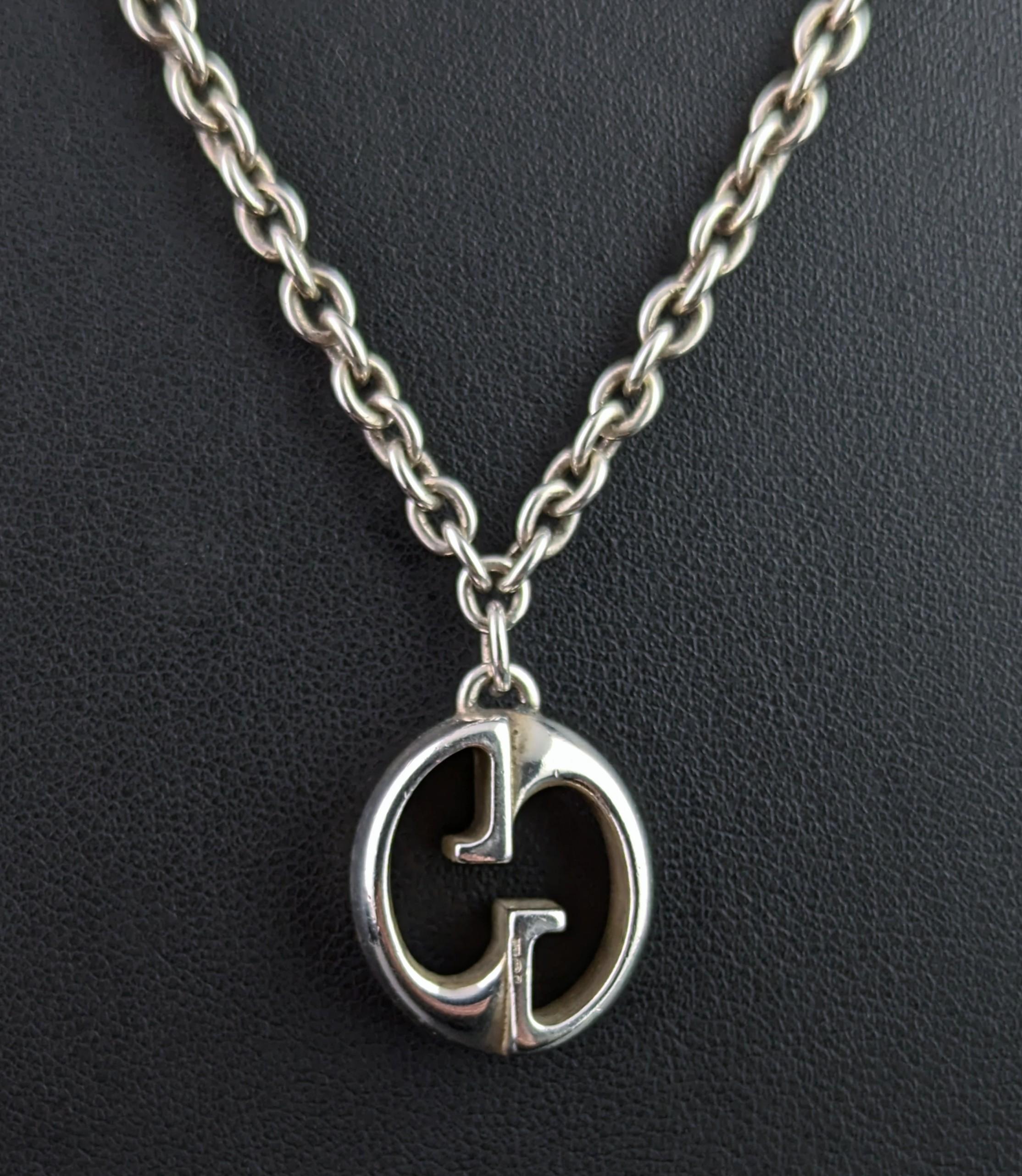 A stylish vintage Gucci sterling silver chain necklace with interlocking GG logo pendant.

A classic and timeless piece from the early 2000s, it is a stylised GG style pendant free suspended from a lovely silver rolo link chain.

A good solid piece,