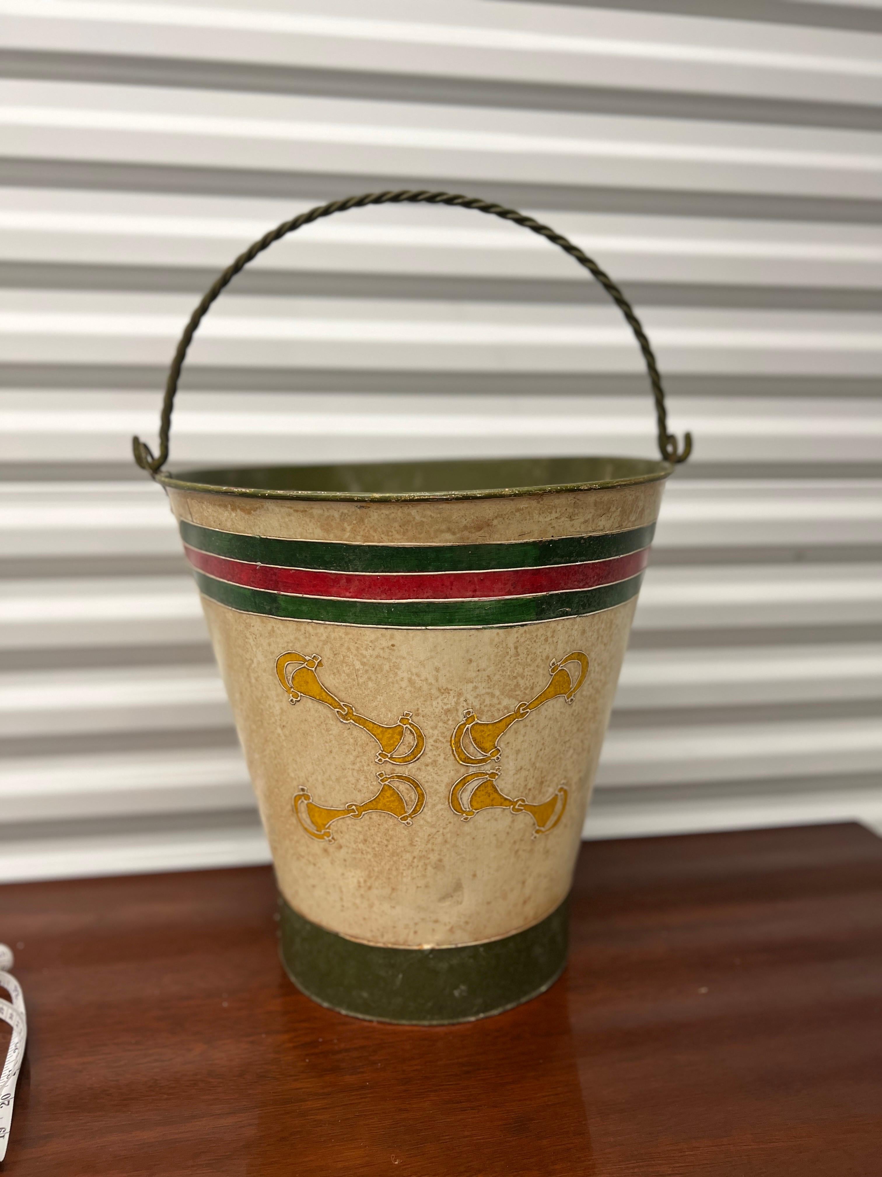 A unique and captivating vintage find: a hand-painted bucket or trash can that exudes the iconic style and sophistication reminiscent of Gucci. This extraordinary piece stands as a testament to the fusion of art and utility, transforming a mundane