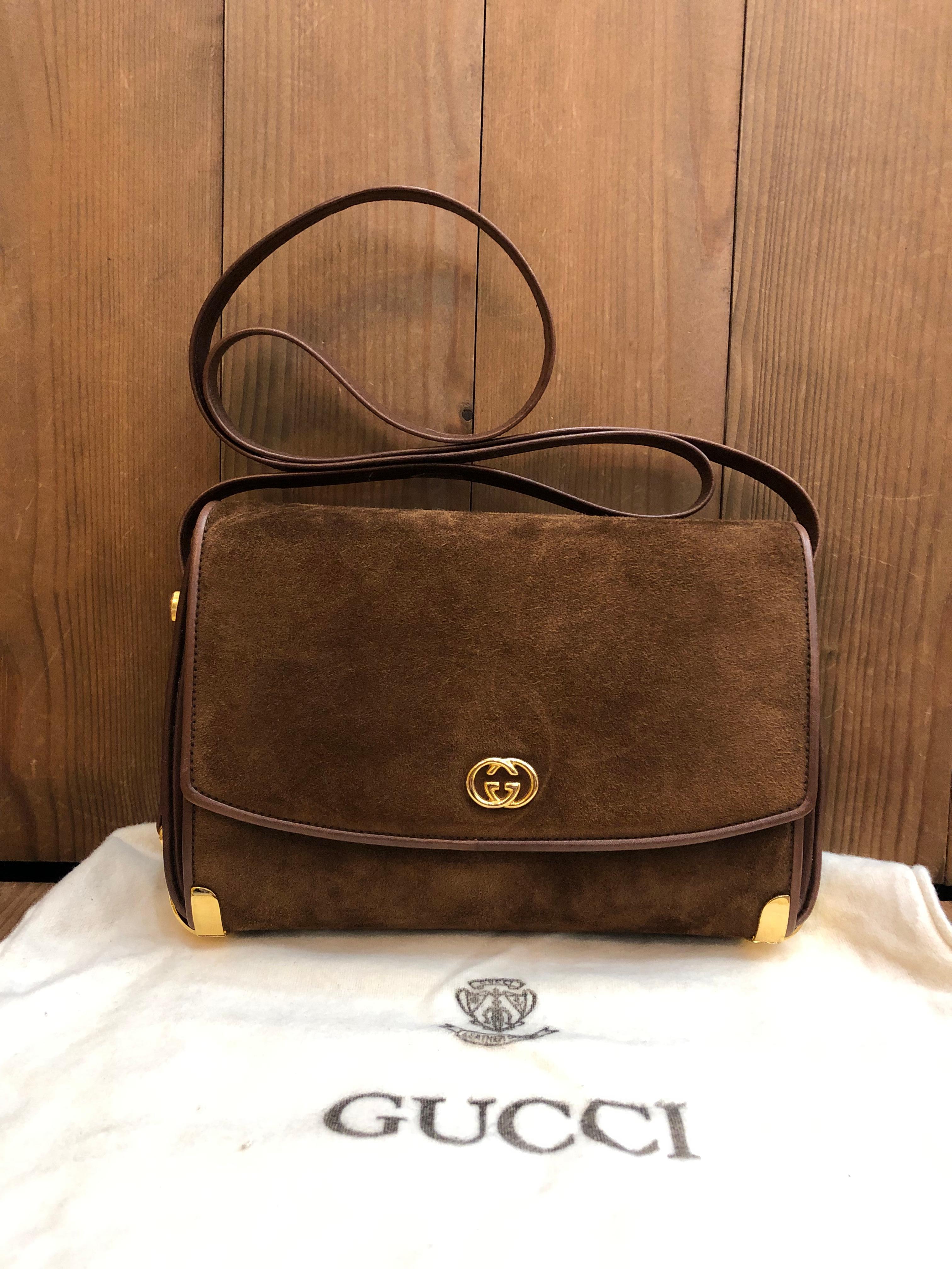 This vintage GUCCI box shoulder bag is crafted of calfskin and nubuck leather in chocolate brown featuring gold toned hardware. Front flap magnetic snap closure opens to three compartments lined with beige leather featuring a zippered pocket.