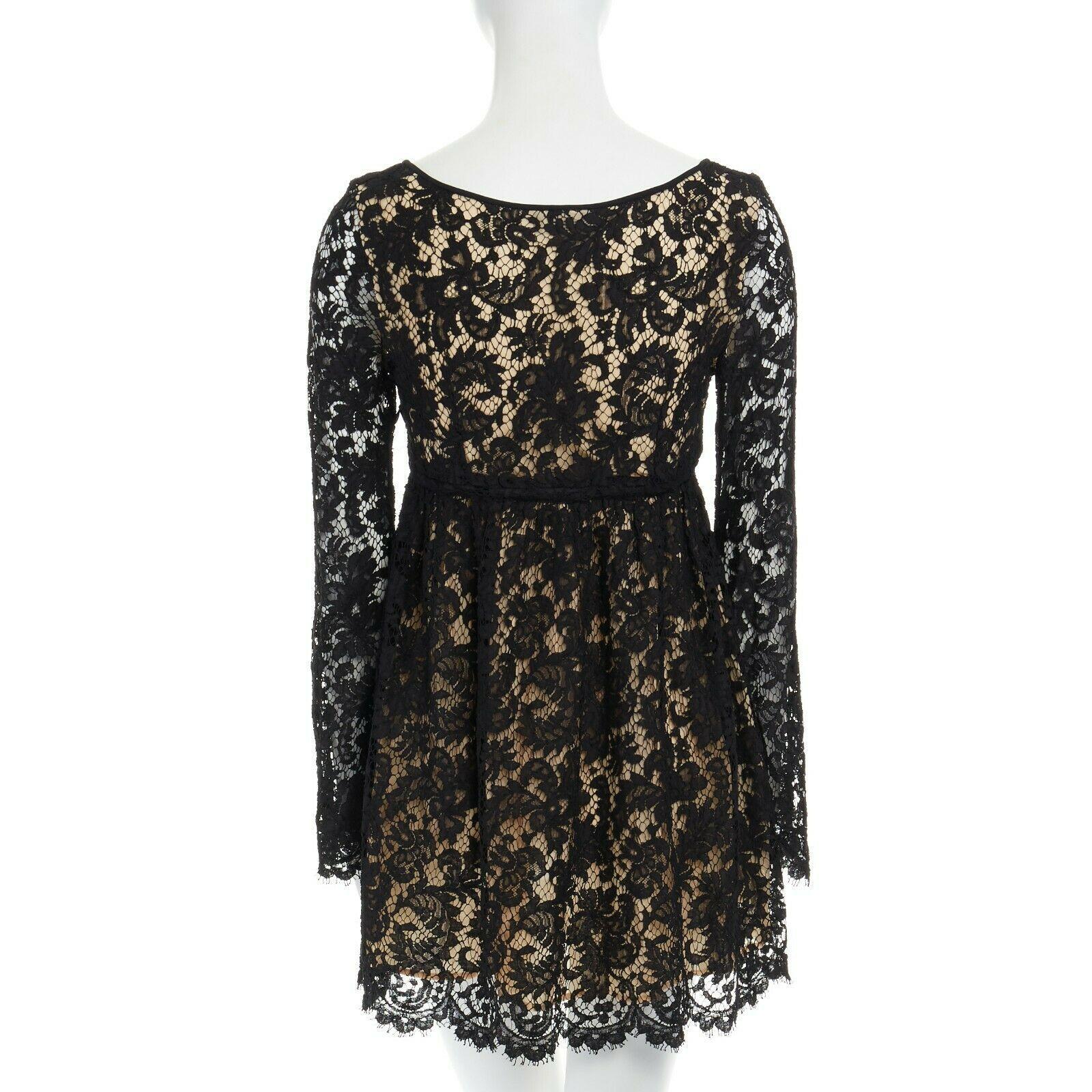 vintage GUCCI TOM FORD SS96 runway black lace scoop flare sleeve mini dress S
GUCCI BY TOM FORD
FROM THE SPRING SUMMER 1996 RUNWAY; 
CAMPAIGN Black floral lace dress. Angular scoop neck. Nude lining at bust. 
Drawstring detail at high waist. Long