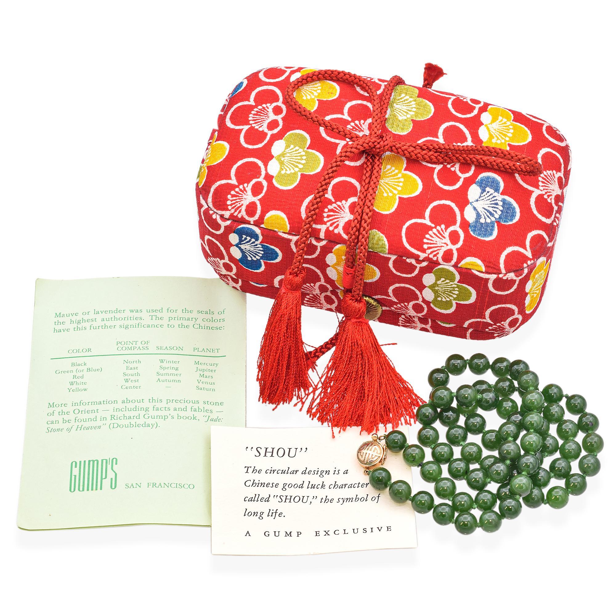 This beautiful beaded necklace is crafted by Gump's San Francisco. It features bold green jade beads, each meticulously polished to a smooth finish.
The necklace is accented with a 