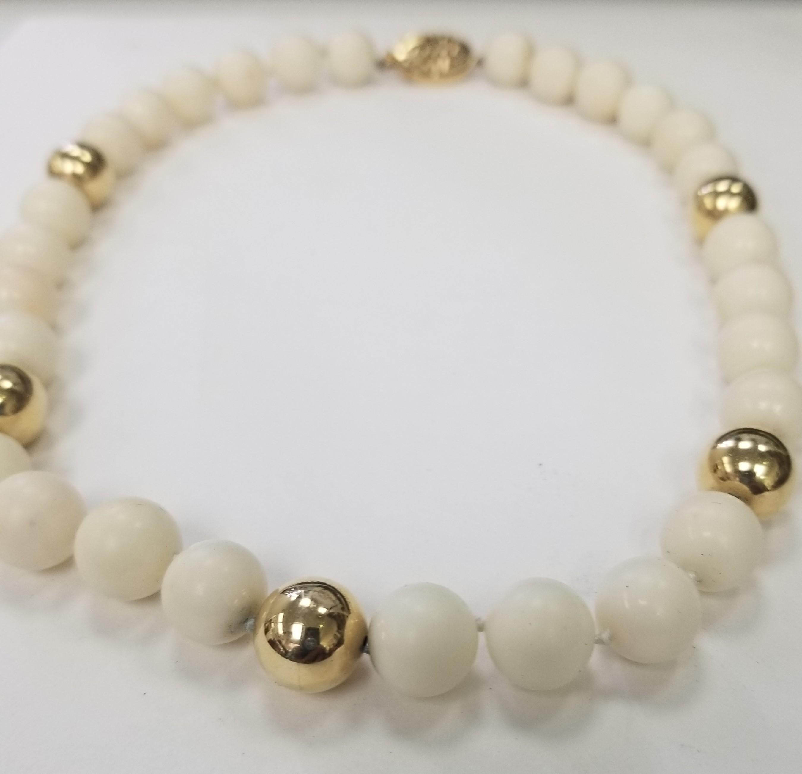  Elegant and finely detailed 12mm Bead Necklace. Hand crafted in 14 Karat Yellow Gold. The Necklace epitomizes vintage charm, taking you from day to evening effortlessly. The Necklace is in excellent condition and was recently professionally cleaned