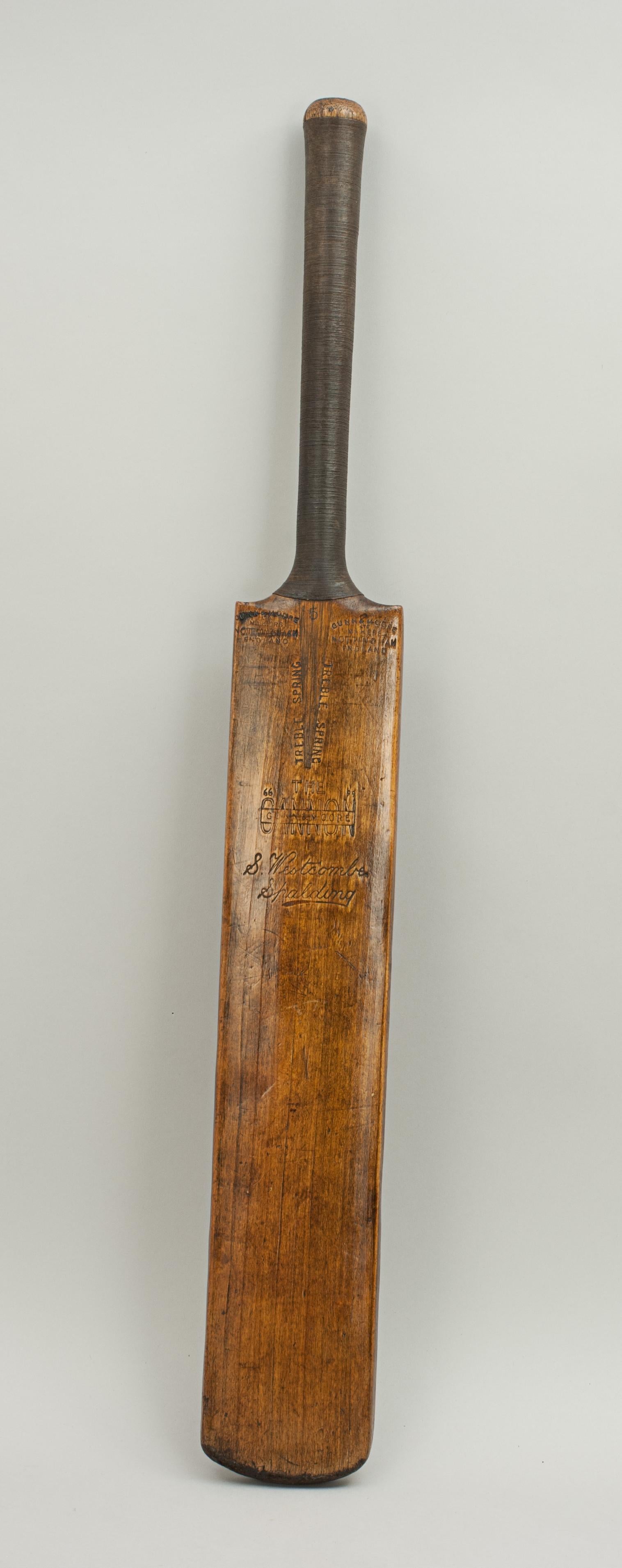 Vintage Gunn and Moore cricket bat.
A good Gunn and Moore cricket bat 'THE CANNON'. The writing on the two shoulders reads: 'GUN & MOORE Ltd, MAKERS, NOTTINGHAM, ENGLAND', whilst on the blade 'TREBLE SPRING, 'THE CANNON', S. Westcombe, Spalding'.
