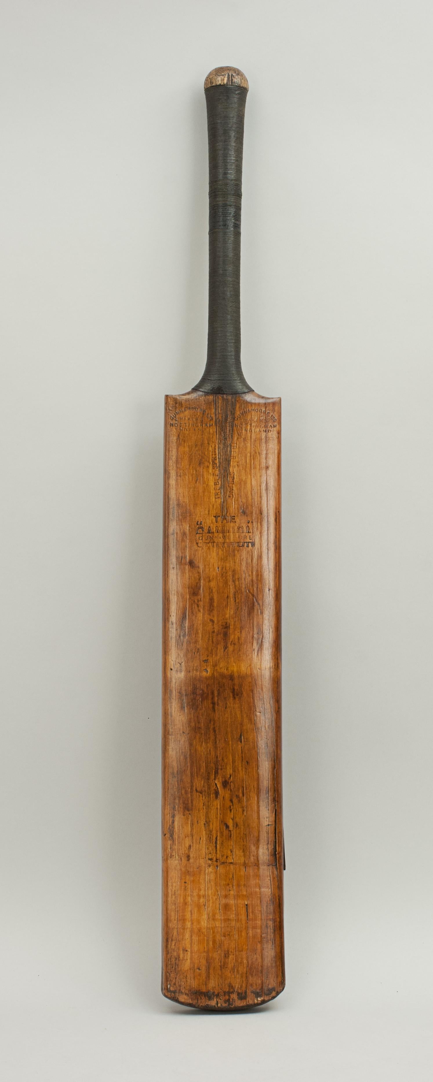 Vintage Gunn and Moore Cricket Bat.
A good Gunn & Moore cricket bat 'THE CANNON'. The writing on the two shoulders reads: 'GUN & MOORE Ltd, MAKERS, NOTTINGHAM, ENGLAND', whilst on the blade 'THE CANNON', TREBLE SPRING'. To the rear of the bat are