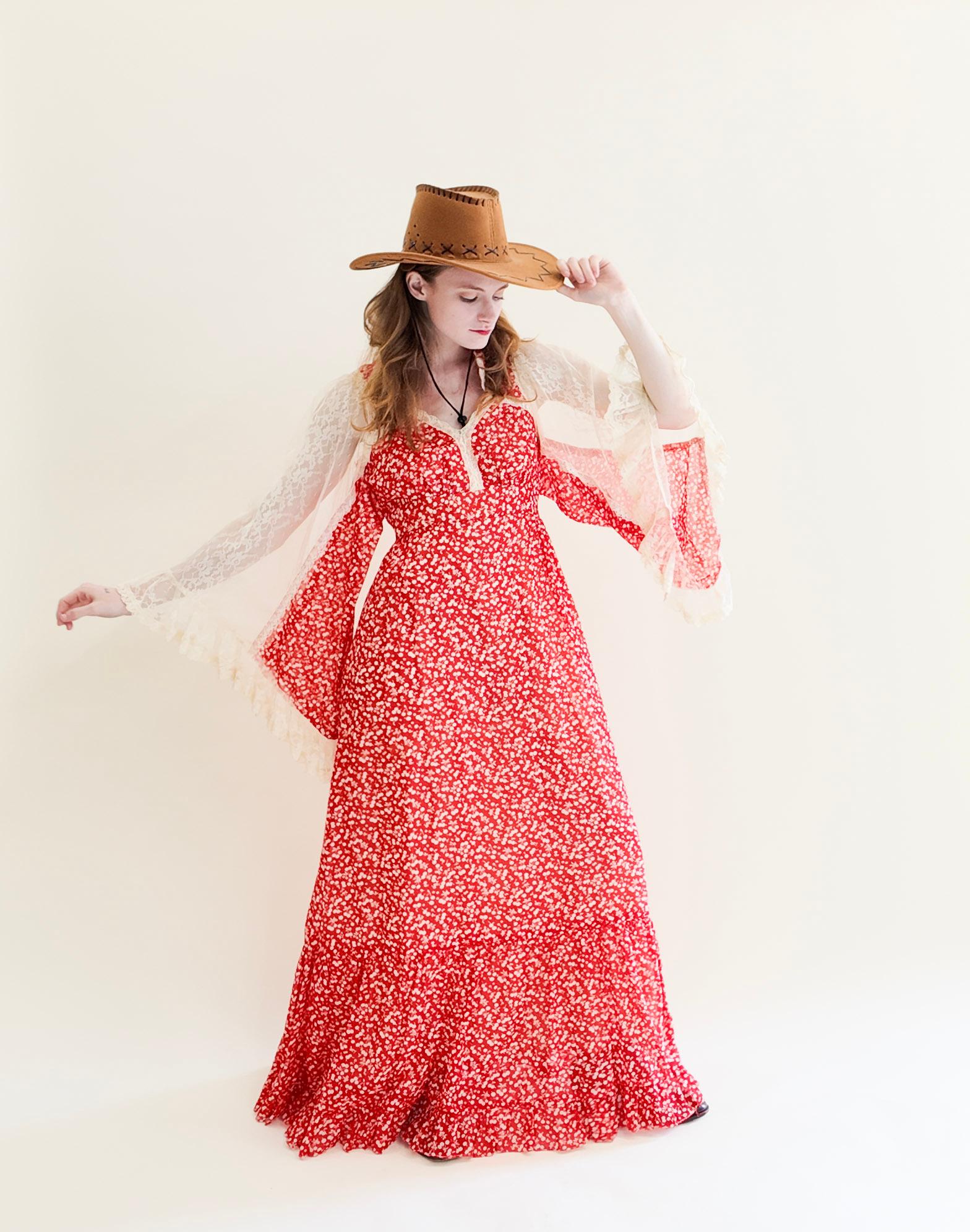 Elevate your spring fashion game with our Vintage Gunne Sax Red Print Lace Bell Sleeve Prairie Dress. This stunning maxi dress features charming bell sleeves and a striking red printed fabric. Embrace a casual and effortlessly chic look with this