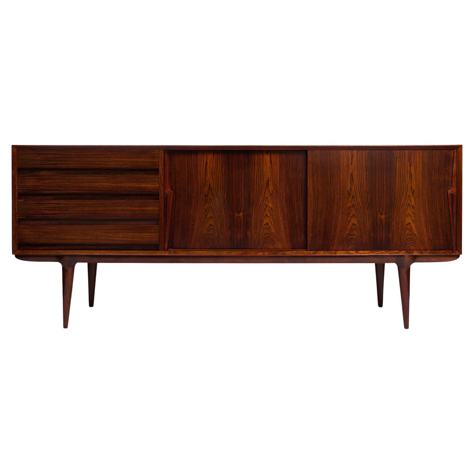 Omann Jun Møbelfabrik, established in 1933 by Andreas Omann, stands as a hallmark of iconic Danish design from the 1950s and 1960s. Renewed in production, this esteemed family-owned enterprise reintroduces the legendary Model 18 credenza, catering