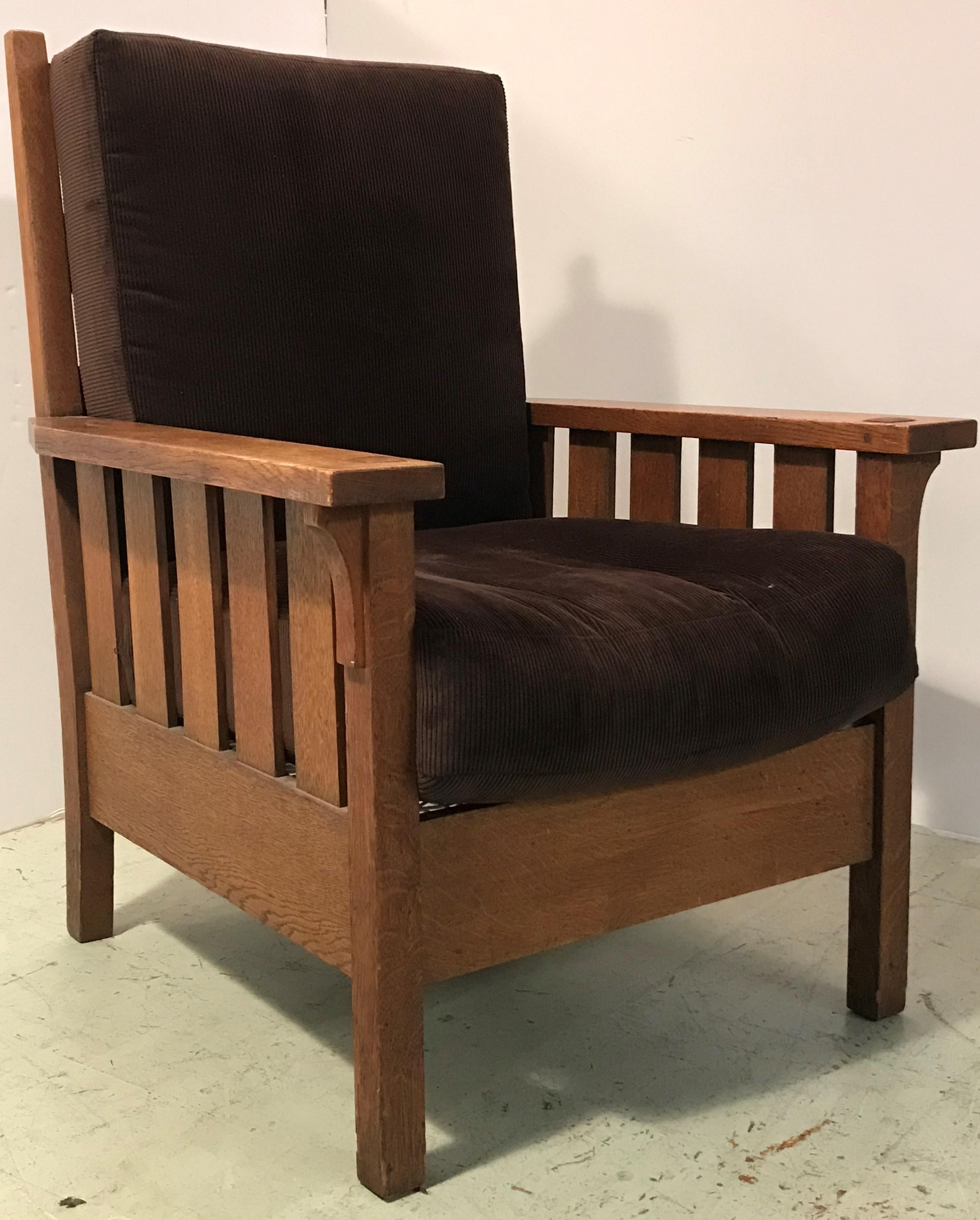 A 1910’s vintage Gustav Stickley Morris chair with original seat pad and restored back pad recovered in a dense soft pile brown corduroy and restored sturdy rope in lieu of caning which gives the seat a firmer feel with slightly more bounce and give