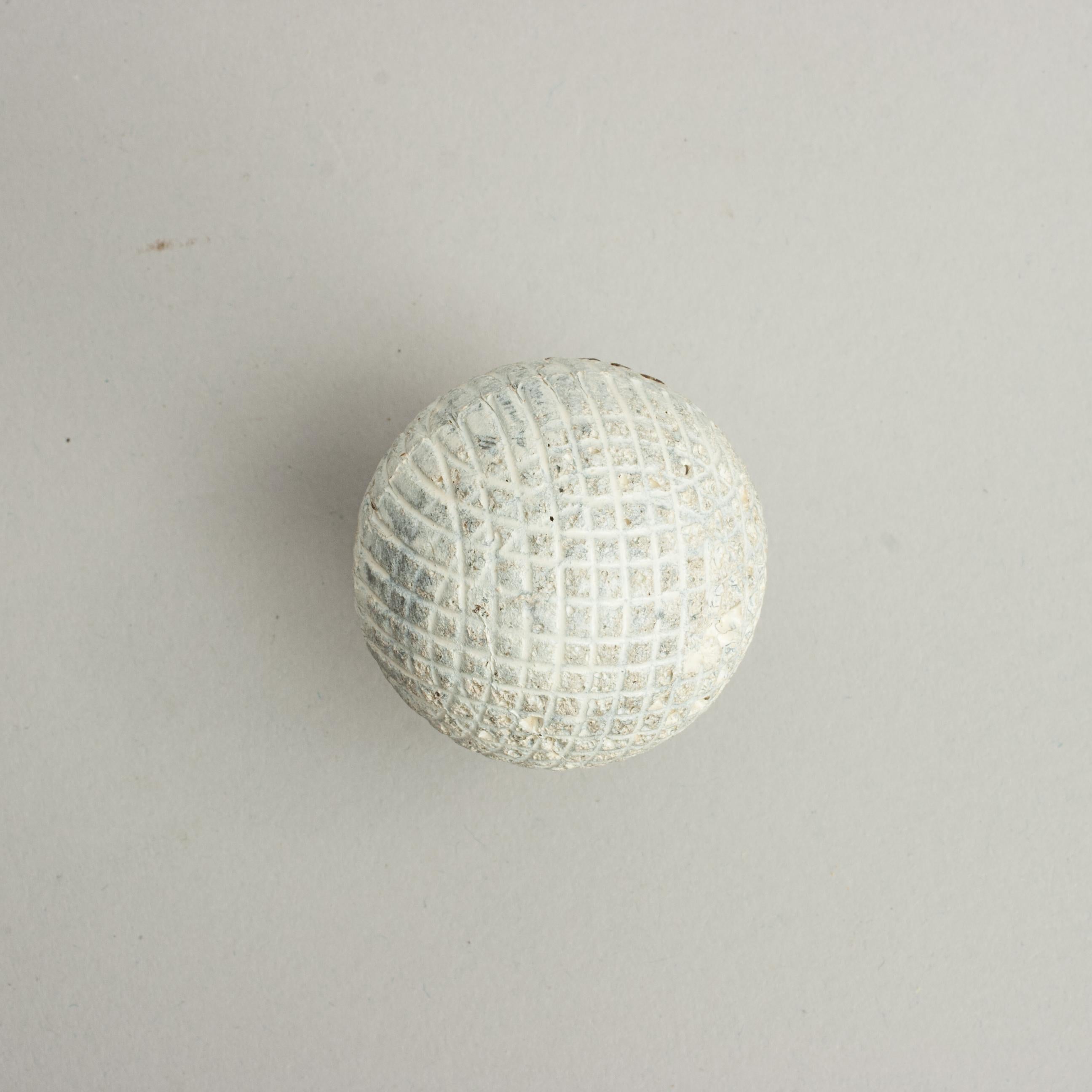 Antique Gutty Golf Ball.
A Victorian moulded mesh patterned gutta percha golf ball. The ball is in a repainted condition and is with the classic mesh pattern.

The ball is approximately 1 5/8 inch in diameter (4.2 cm).

The solid gutty golf