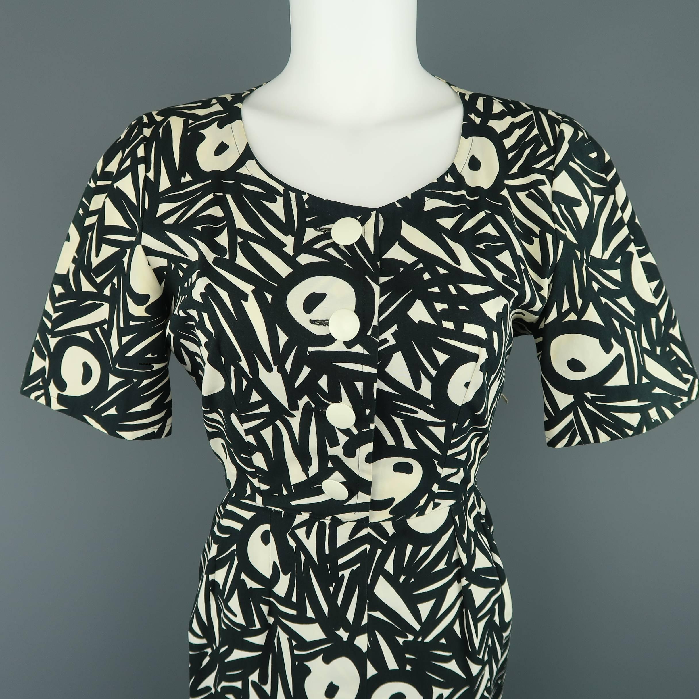 Vintage GUY LAROCHE dress comes in a black and cream abstract print cotton with a round scoop neck, button up blouse top, short puff sleeves, and pencil skirt. Discolorations throughout. As-is. Made in France.
 
Fair Pre-Owned Condition.
Marked: FR