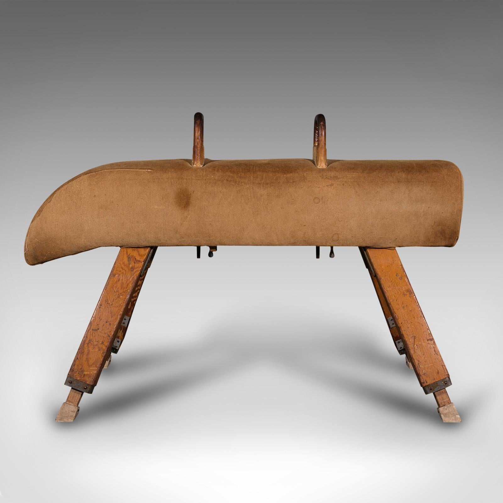 This is a vintage gymnastic pommel horse. An English, suede and pine athletic vaulting apparatus, dating to the mid 20th century, circa 1960.

Supremely solid vaulting horse, ideal for continued use today
Displays a desirable aged patina with